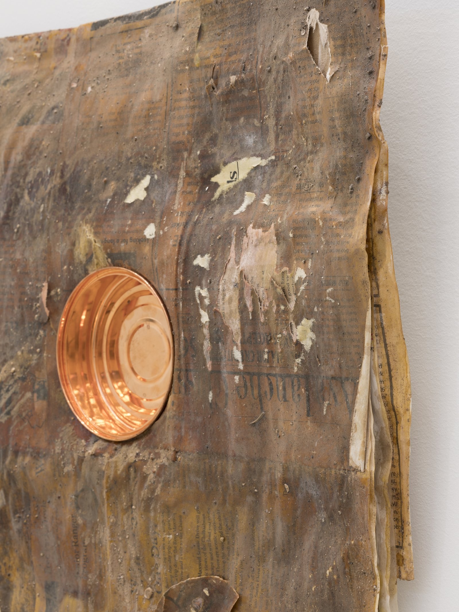 Rochelle Goldberg, Dirty Wall (detail), 2019, newsprint, shellac, copperplated can, dirt from the river, 16 x 18 in. (41 x 45 cm)