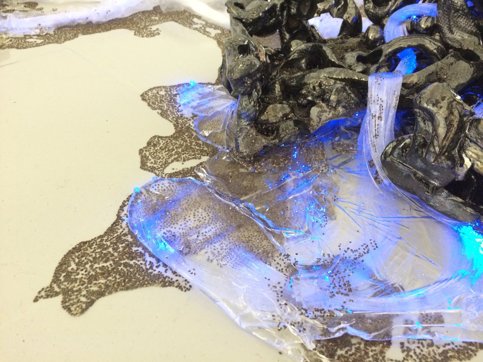 Rochelle Goldberg, Leaked Into Fixture (detail), 2015, fibre-optic fibres, cables, ceramic, resin, chia seeds, LED bulb, 8 x 99 x 58 in. (20 x 250 x 147 cm). Installation view, BODY BILDUNG, Galerie Max Mayer, Dusseldorf, Germany, 2015