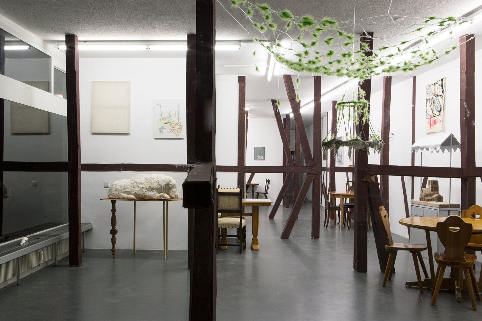 Rochelle Goldberg, Nest, 2017, feather, nylon, acrylic, lamp fossil, 63 x 71 x 39 in. (160 x 180 x 100 cm). Installation view, Zur Rebschänke, Weiss Falk, Basel, 2017