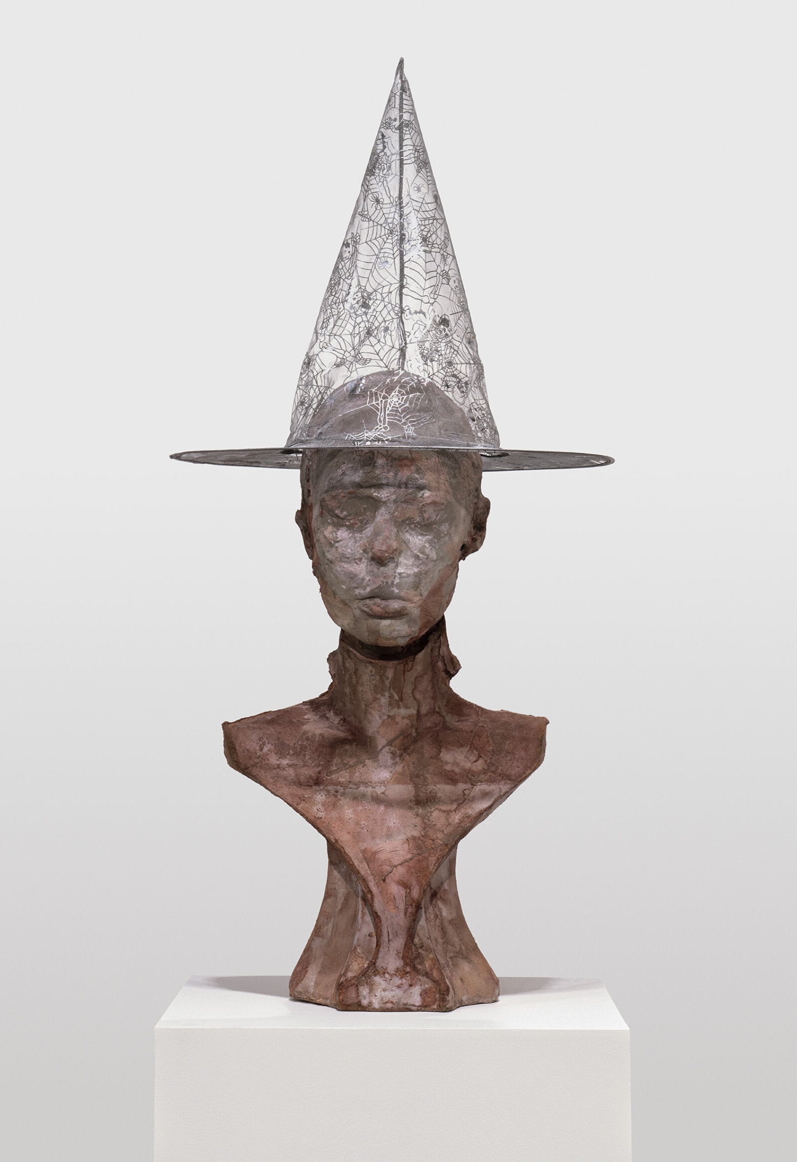 Rochelle Goldberg, Portrait as Witch, 2022, concrete, plaster, shellac, tissue, acrylic dispersion paint, polyester hat, 61 x 16 x 16 in. (155 x 39 x 39 cm)