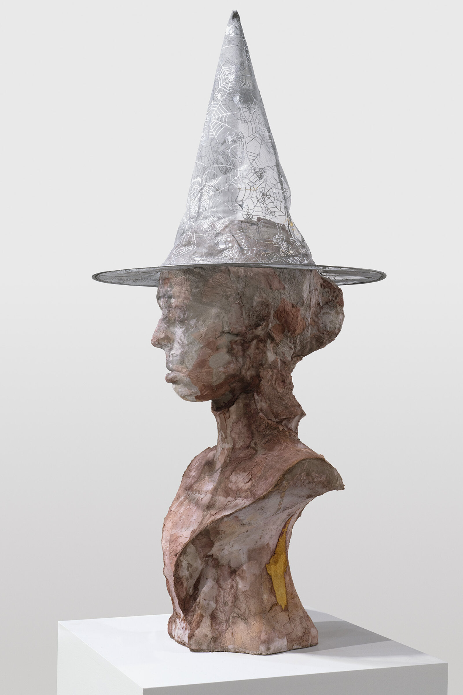 Rochelle Goldberg, Portrait as Witch, 2022, concrete, plaster, shellac, tissue, acrylic dispersion paint, polyester hat, 61 x 16 x 16 in. (155 x 39 x 39 cm)