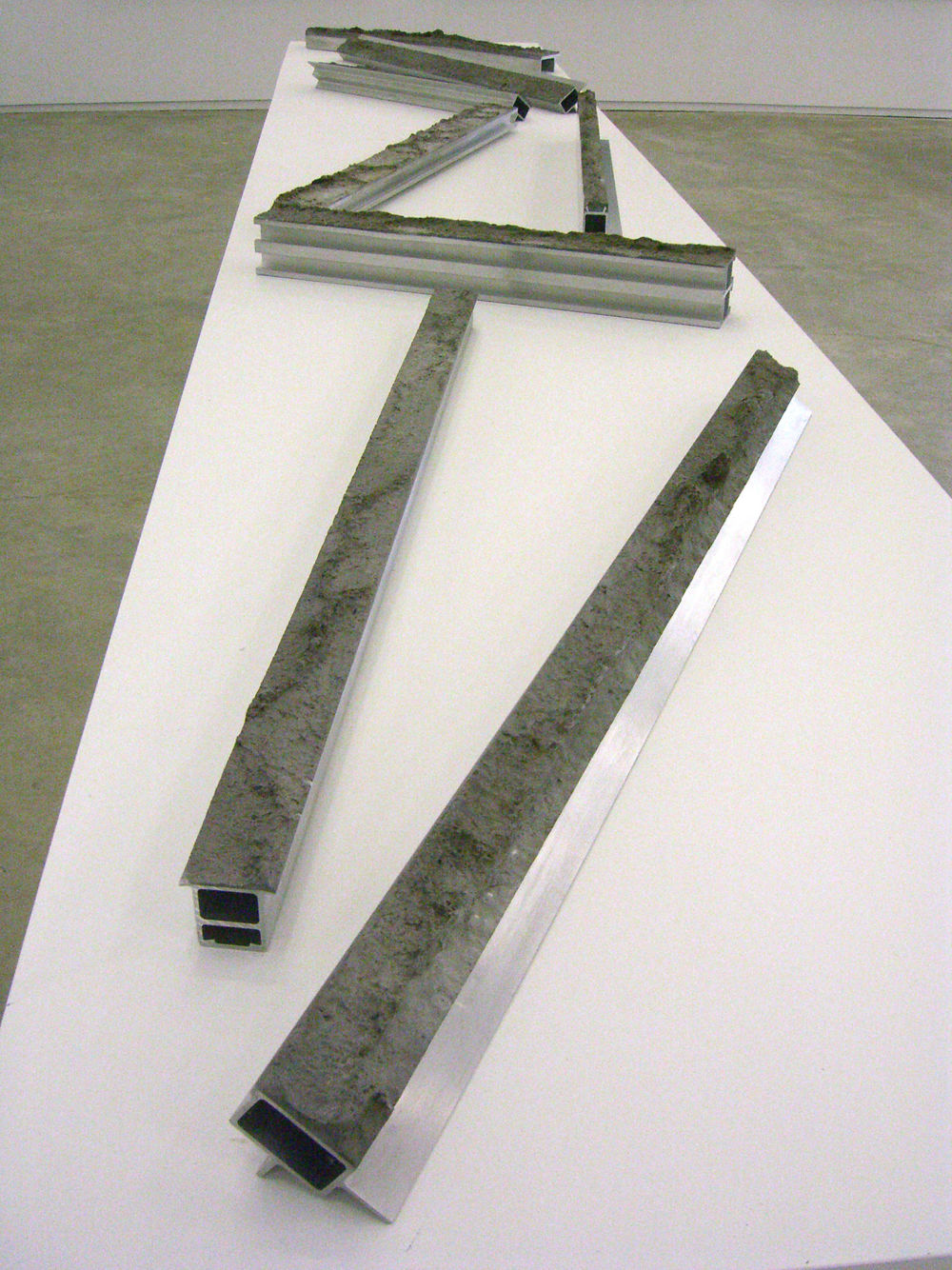 ​Germaine Koh, Pressions Topographiques, 2005, aluminum-factory waste, metallized polyester, traces of asphalt and dirt, dimensions variable by 
