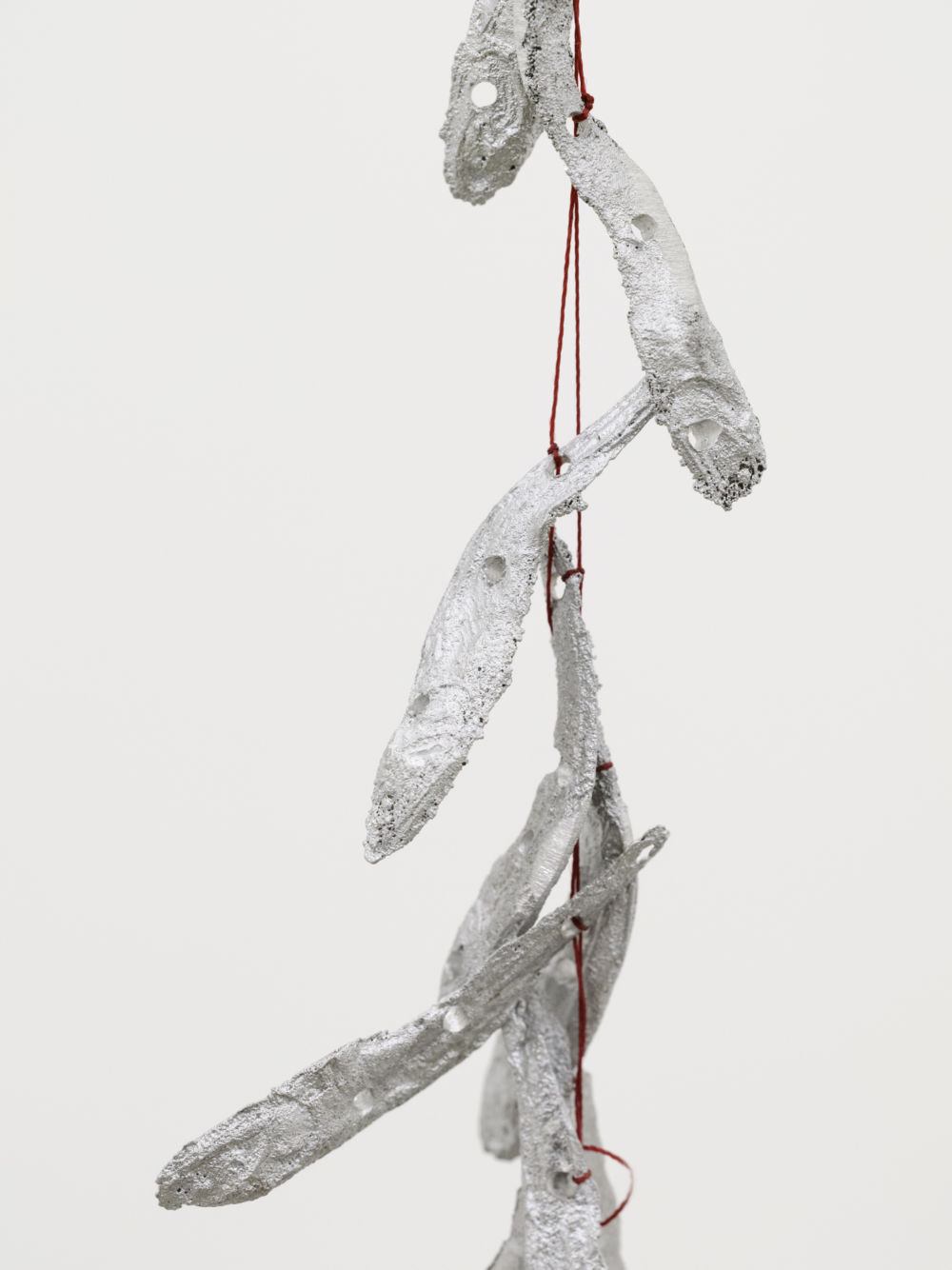 Laurie Kang, Plexus (detail), 2022, cast aluminum anchovies, thread, 102 1/4 x 4 x 4 in. (260 x 10 x 10 cm) by 