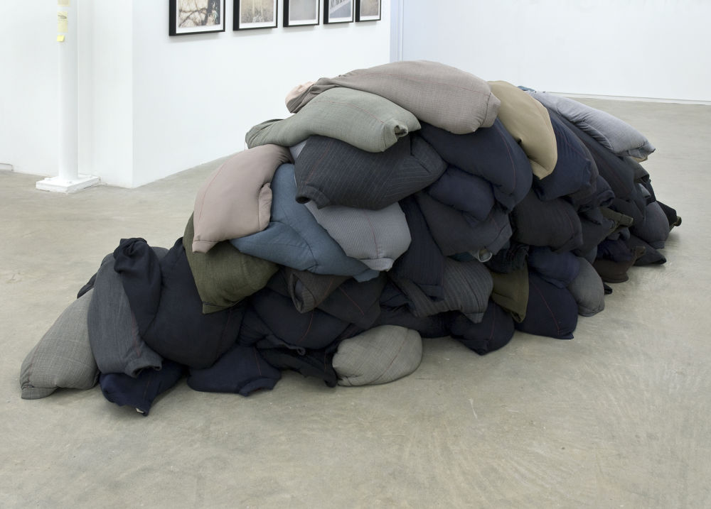 Rebecca Belmore, Thin Red Line, 2009, suit jackets, sand, dimensions variable by 