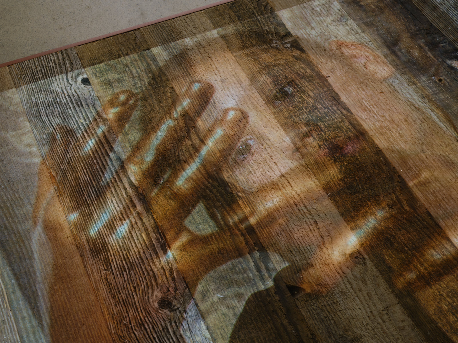 Tanya Lukin Linklater, They fall the ground beneath you (detail), 2018, video projection, performance platforms, marine lumber, paint, performance activation in presence of Sonya Kelliher-Combs’ ‘Curl’ works, dimensions variable
