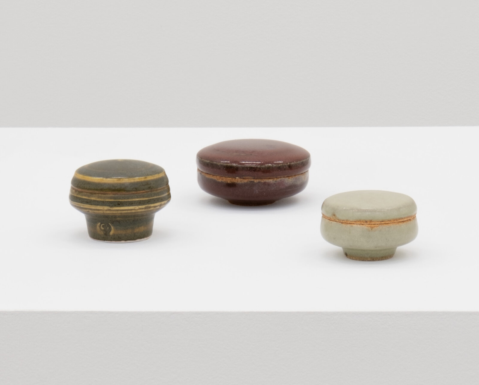 Charmian Johnson, not titled, date unknown, glazed ceramics, 2 x 3 x 3 in. (4 x 6 x 6 cm); 1 x 3 x 3 in. (3 x 8 x 8 cm); 1 x 2 x 2 in. (3 x 6 x 6 cm)