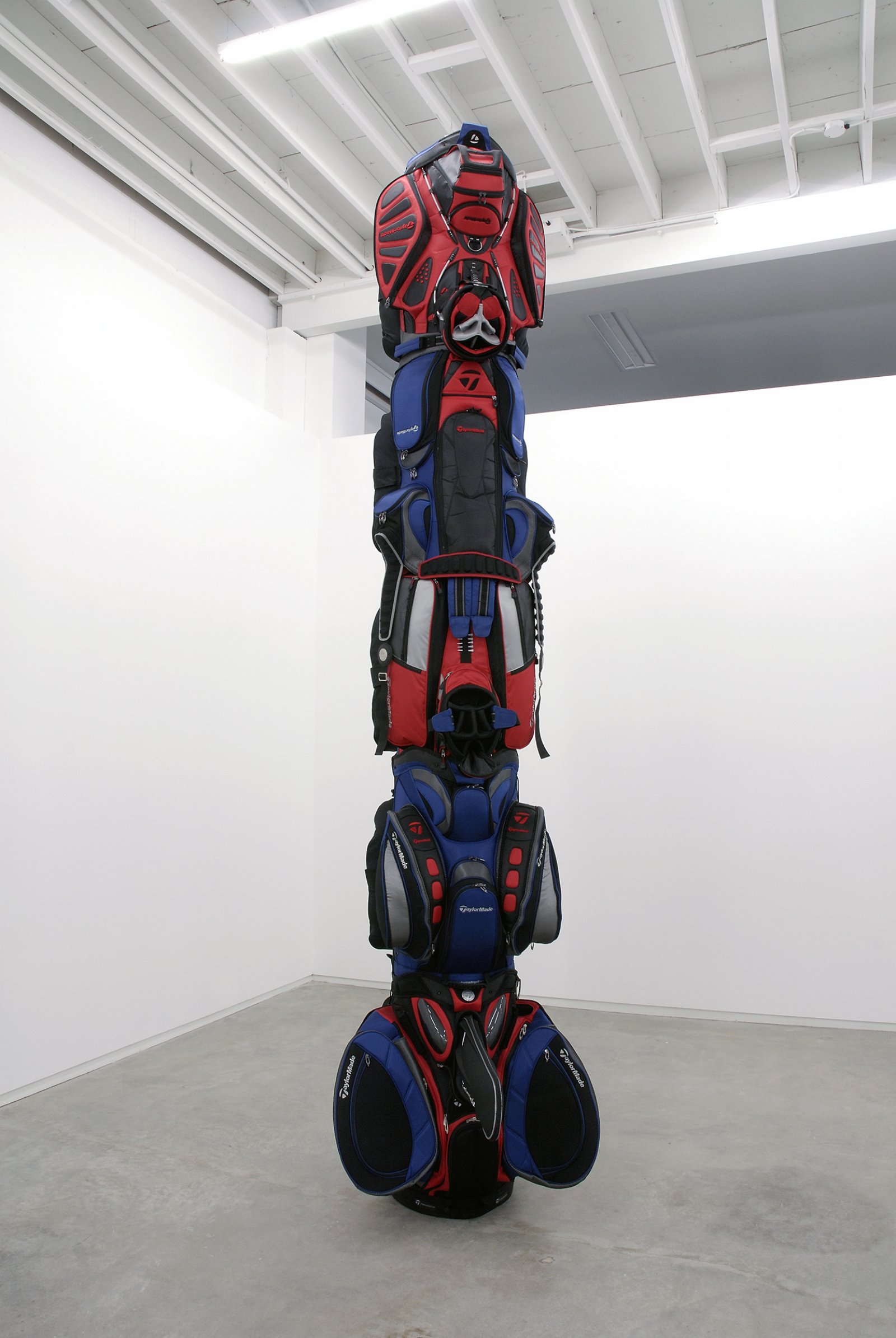 Brian Jungen, 1960, 2007, golf bags, cardboard tube, 155 x 36 x 48 in. (394 x 91 x 122 cm)   by Brian Jungen