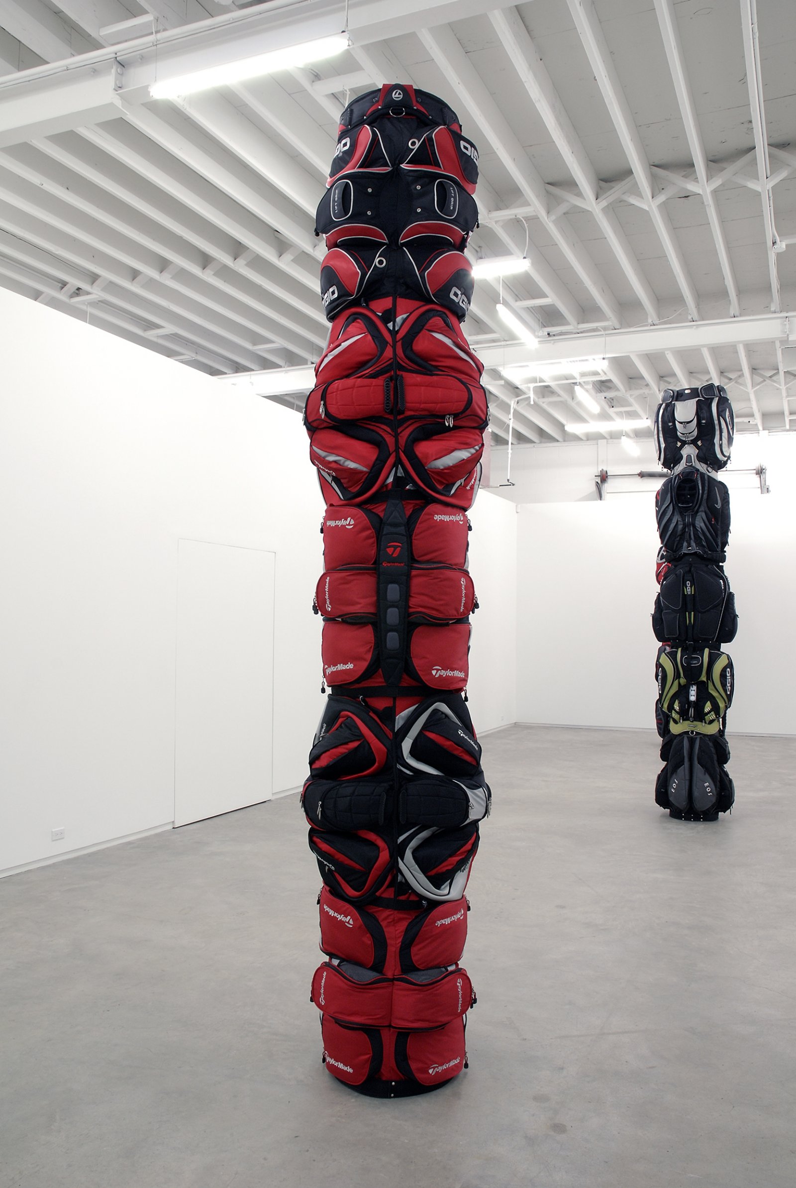 Brian Jungen, 1980, 2007, golf bags, cardboard tube, 138 x 27 x 27 in. (351 x 69 x 69 cm)   by Brian Jungen