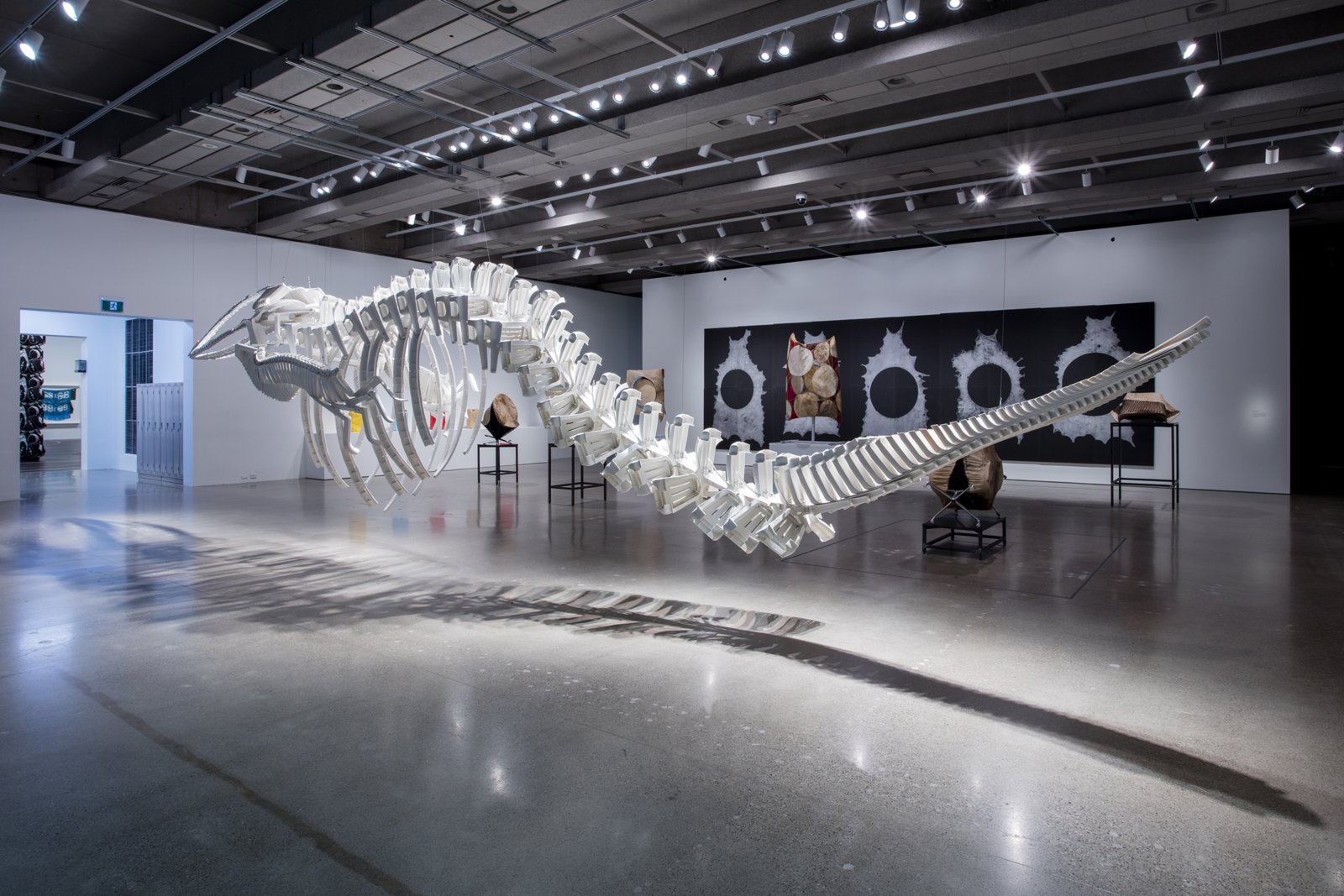 Brian Jungen, Cetology, 2002, plastic chairs, 159 x 166 x 587 in. (404 x 422 x 1491 cm). Installation view, Friendship Centre, Art Gallery of Ontario, Toronto, Canada, 2019