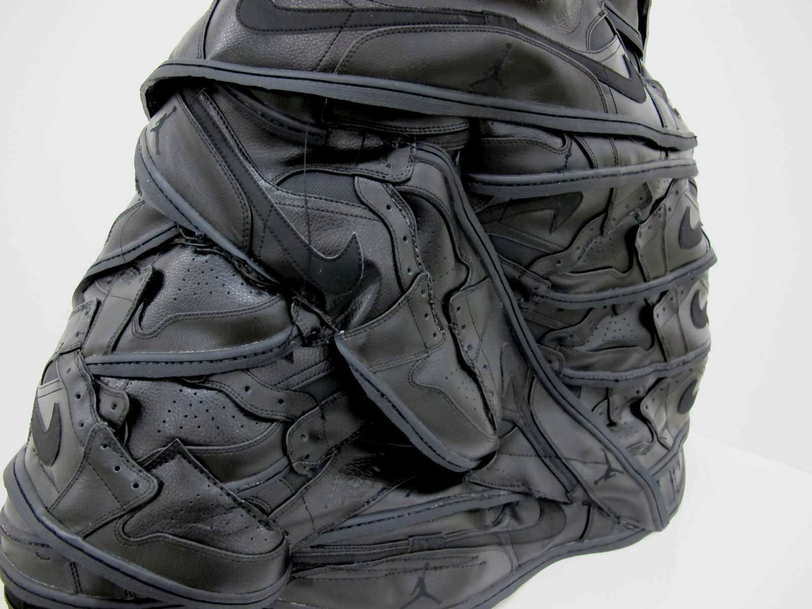 Brian Jungen, I Shall Be Released (detail), 2015, nike air jordan shoes (black, #1), 29 x 26 x 12 in. (74 x 66 x 31 cm)