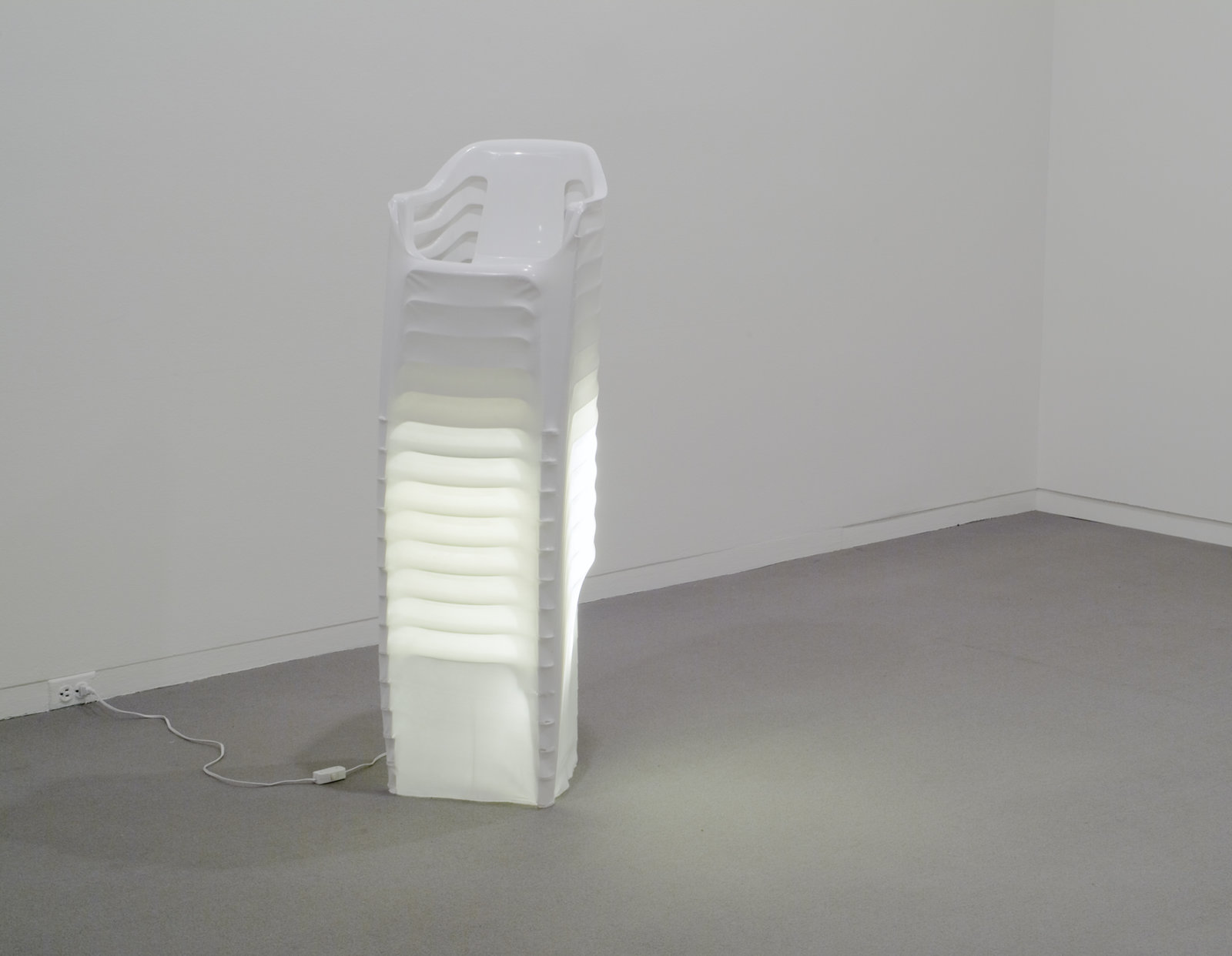 Brian Jungen, Mise en scene, 2000, plastic chairs, polyethylene, fluorescent lights, 51 x 15 x 14 in. (128 x 38 x 34 cm)