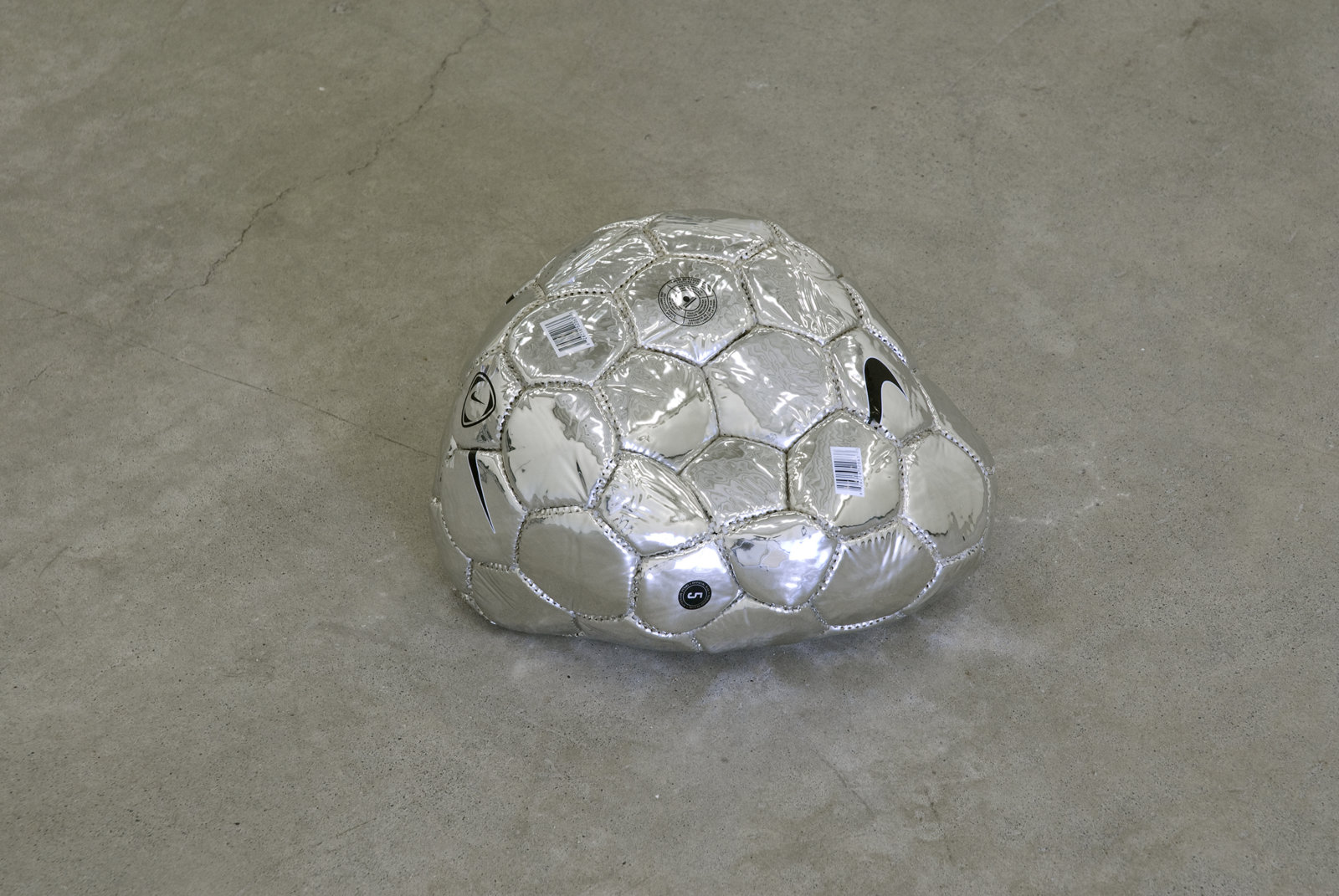 Brian Jungen, Modern Sculpture (After Iceland) (detail), 2005, 6 sculptural forms of lava rock and soccer balls, dimensions variable