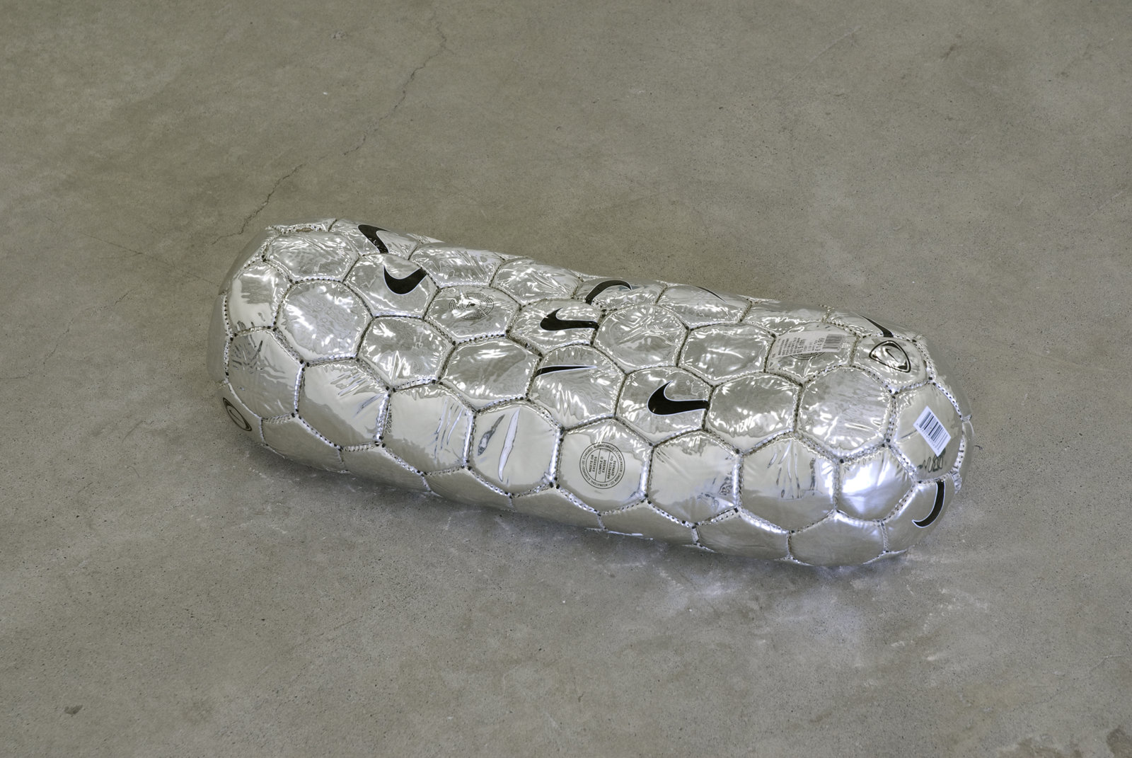 Brian Jungen, Modern Sculpture (After Iceland) (detail), 2005, 6 sculptural forms of lava rock and soccer balls, dimensions variable