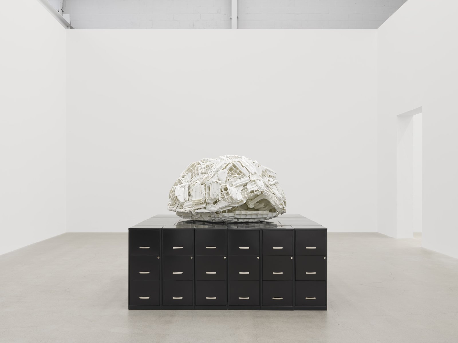 Brian Jungen, Tombstone, 2019, rubbermaid step stools, filing cabinets, 69 x 107 x 86 in. (174 x 272 x 217 cm)