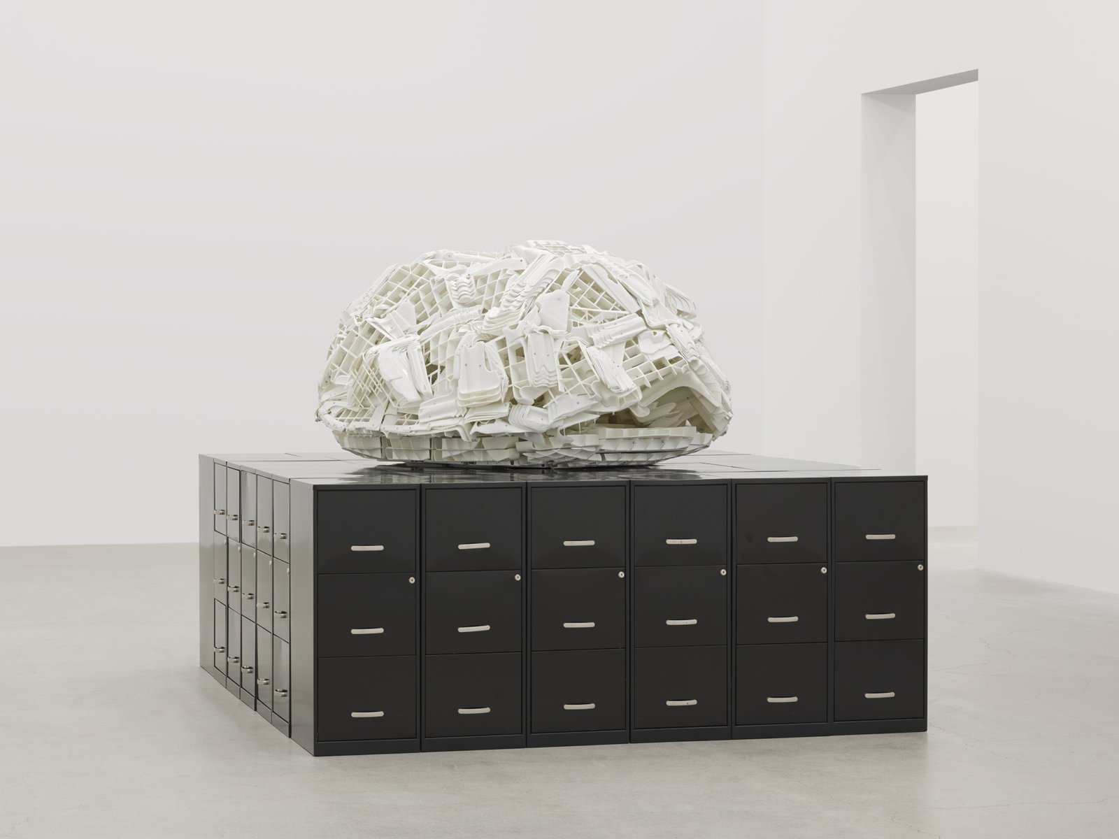 Brian Jungen, Tombstone, 2019, rubbermaid step stools, filing cabinets, 69 x 107 x 86 in. (174 x 272 x 217 cm)