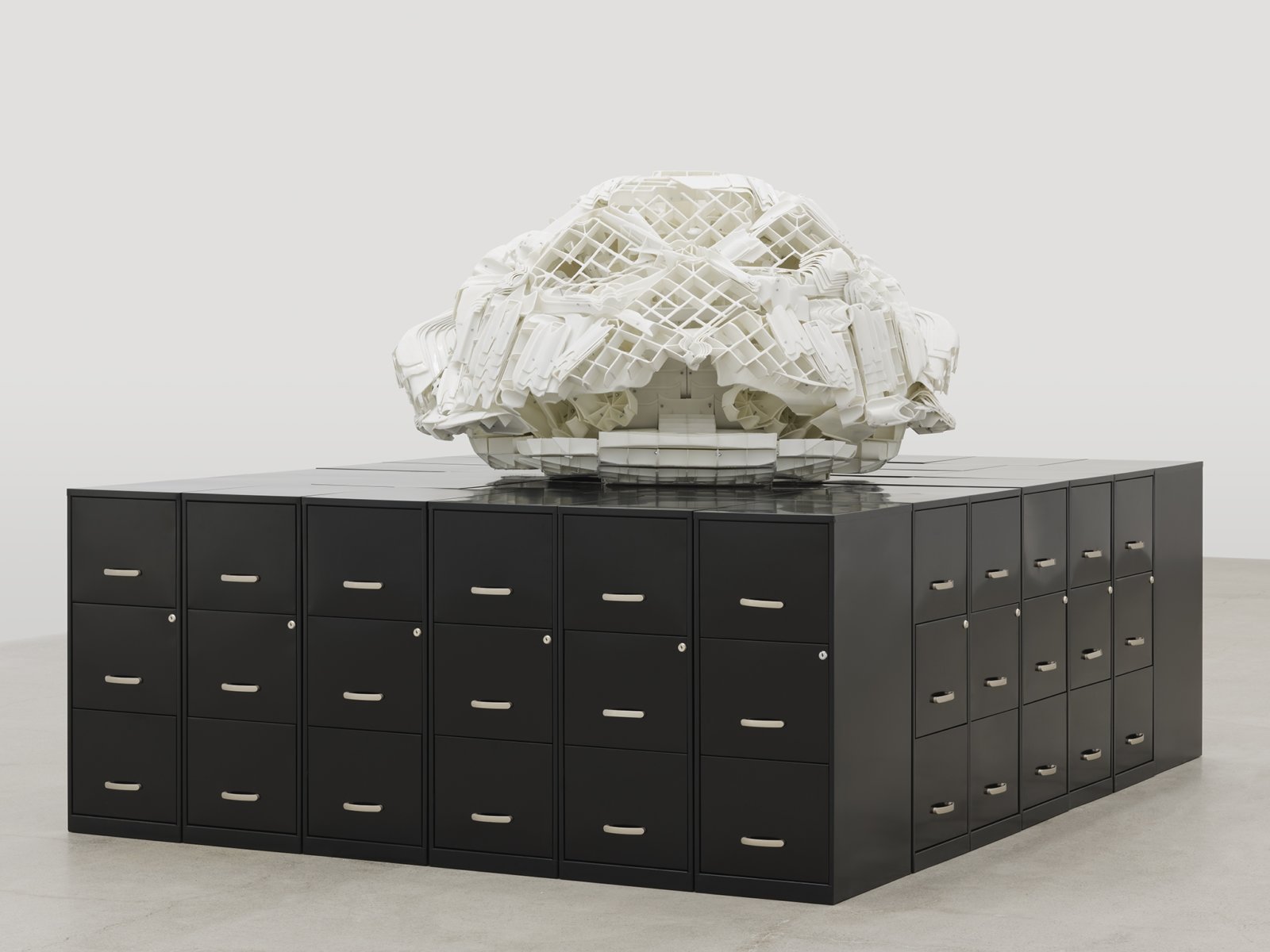 Brian Jungen, Tombstone, 2019, rubbermaid step stools, filing cabinets, 69 x 107 x 86 in. (174 x 272 x 217 cm)