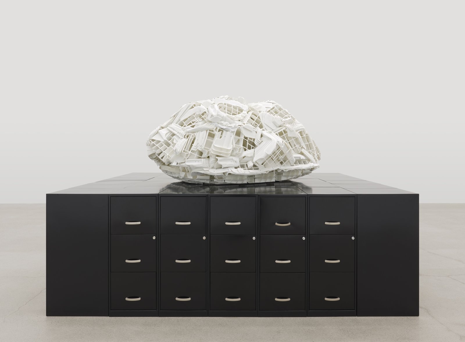 Brian Jungen, Tombstone, 2019, rubbermaid step stools, filing cabinets, 69 x 107 x 86 in. (174 x 272 x 217 cm)