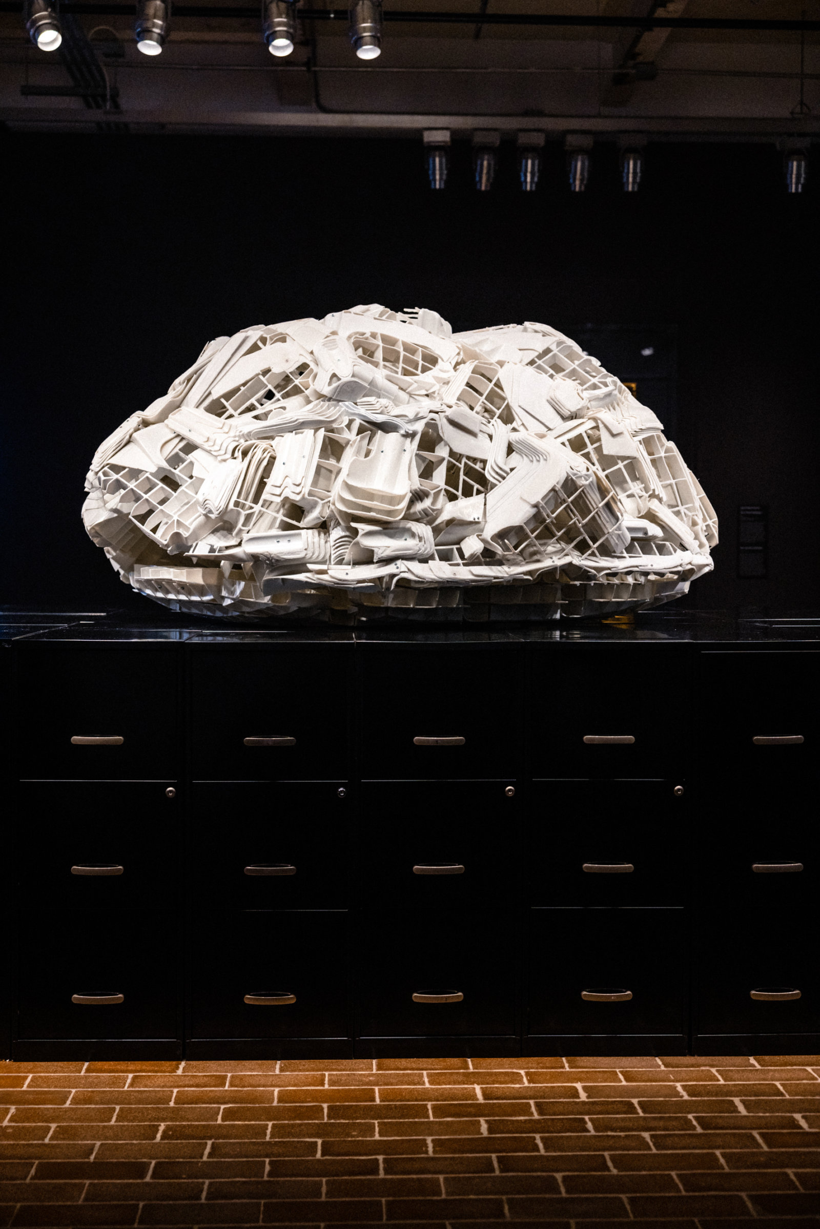 Brian Jungen, Tombstone (detail), 2019, rubbermaid step stools, filing cabinets, 69 x 107 x 86 in. (174 x 272 x 217 cm). Installation view, Jungen, A Divided Landscape The Momentary, Bentonville, USA, 2022