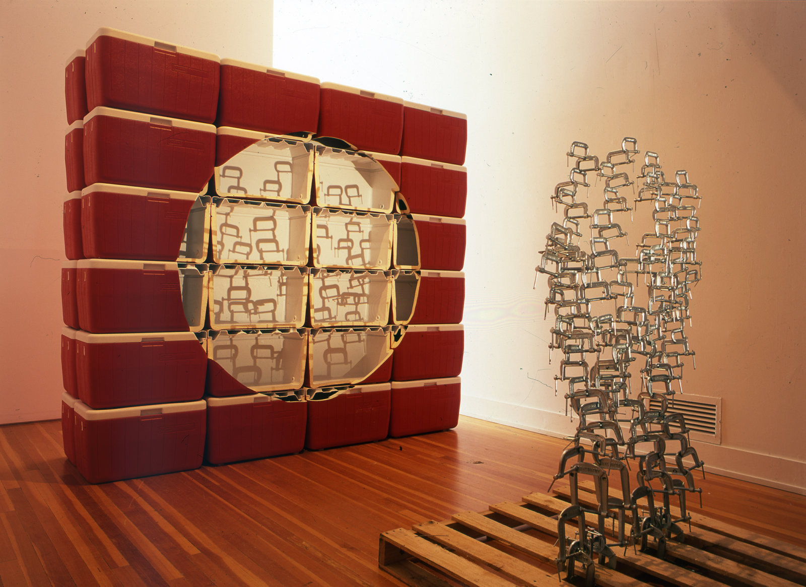 Brian Jungen, Void, 2002, coleman coolers, wooden palette, metal clamps, light, 87 x 96 x 27 in. (221 x 244 x 69 cm)