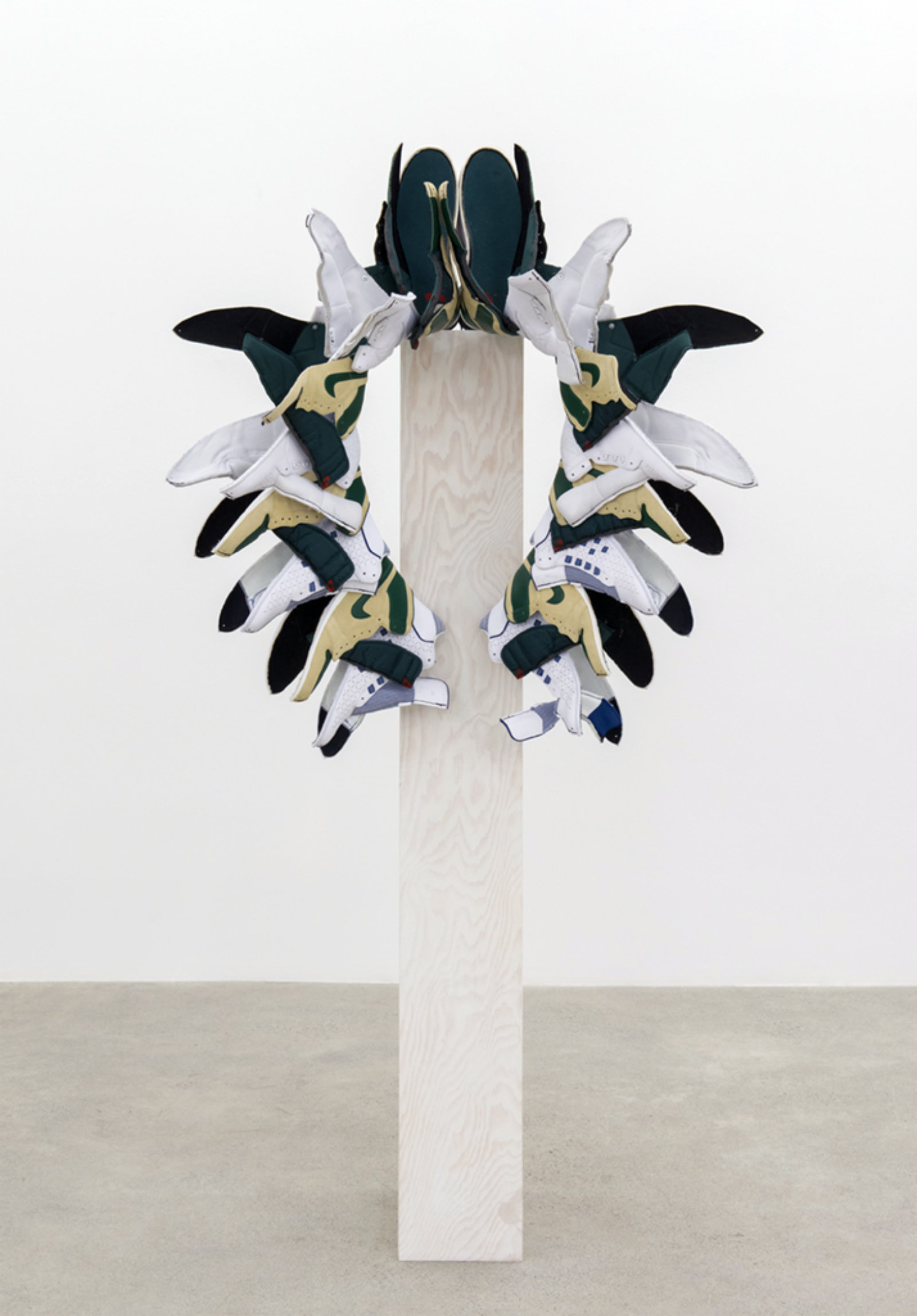 Brian Jungen, Walk This Way (Fall), 2015–2016, nike air jordans, painted fir plywood, stainless steel, 75 x 24 x 24 in. (191 x 61 x 61 cm)