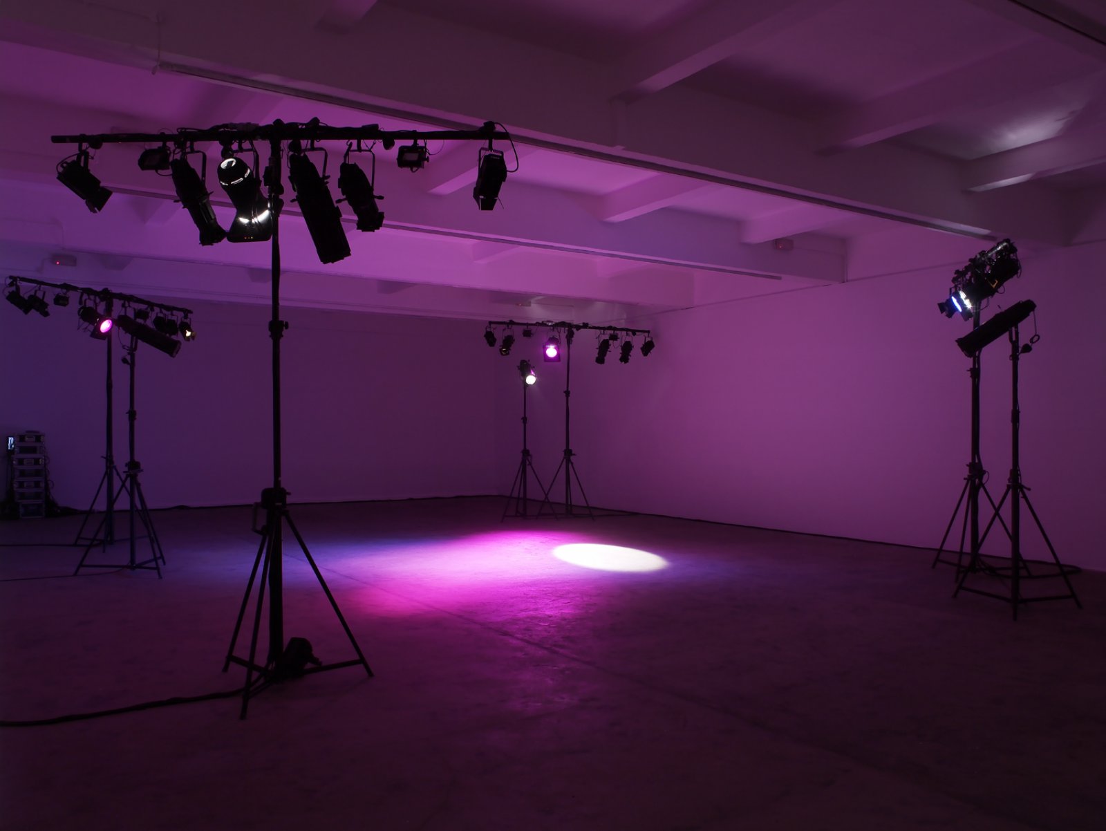 Janice Kerbel, Kill The Workers, 2011, 22 minute play for stage lights, comprising 7 lantern tripods with scaff bars, 38 lanterns (8 floods, 11 pro­files, 15 fres­nels, 4 par­cans), 4 colour scrollers, 6 colour gels, 1 gobo, 1 strand 530i desk group, dimensions variable. Installation view, Kill The Workers!, Chisenhale, London, UK, 2011