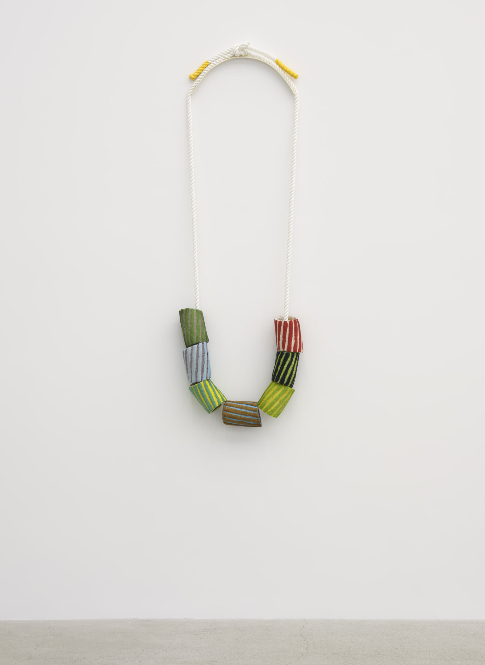 Devon Knowles, Grains of Sand, 2024, glass frit, nylon rope, painted metal, rubber, 56 x 18 x 4 in. (142 x 45 x 10 cm)