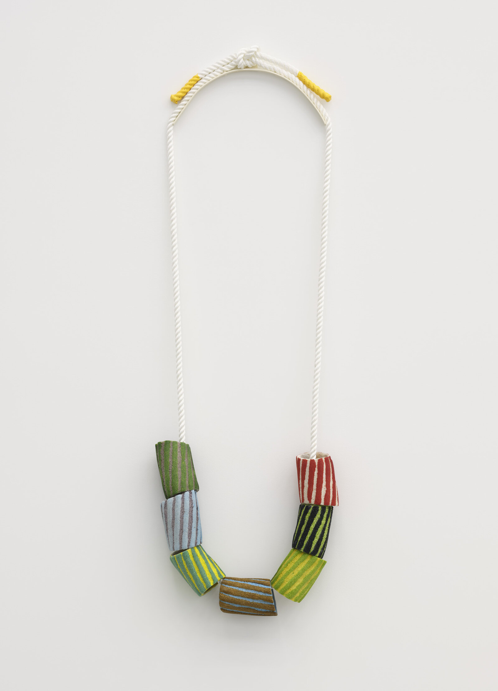 Devon Knowles, Grains of Sand, 2024, glass frit, nylon rope, painted metal, rubber, 56 x 18 x 4 in. (142 x 45 x 10 cm)