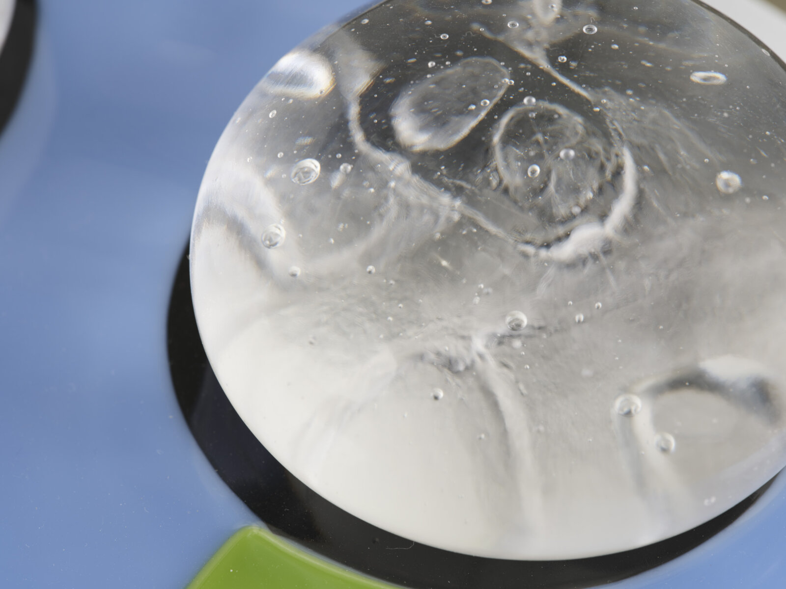 Devon Knowles, Is, Was, Here (detail), 2022, glass, 3 parts, yellow 3 x 10 x 7 in. (6 x 25 x 18 cm); blue 3 x 10 x 7 in. (6 x 25 x 17 cm); mint 2 x 10 x 7 in. (5 x 25 x 18 cm)