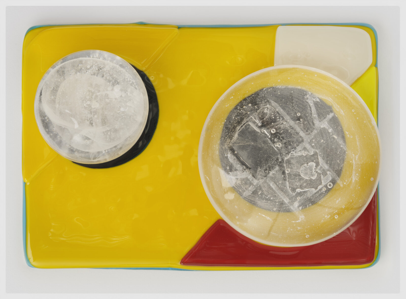 Devon Knowles, Is, Was, Here, 2022, glass, 3 parts, yellow 3 x 10 x 7 in. (6 x 25 x 18 cm); blue 3 x 10 x 7 in. (6 x 25 x 17 cm); mint 2 x 10 x 7 in. (5 x 25 x 18 cm)