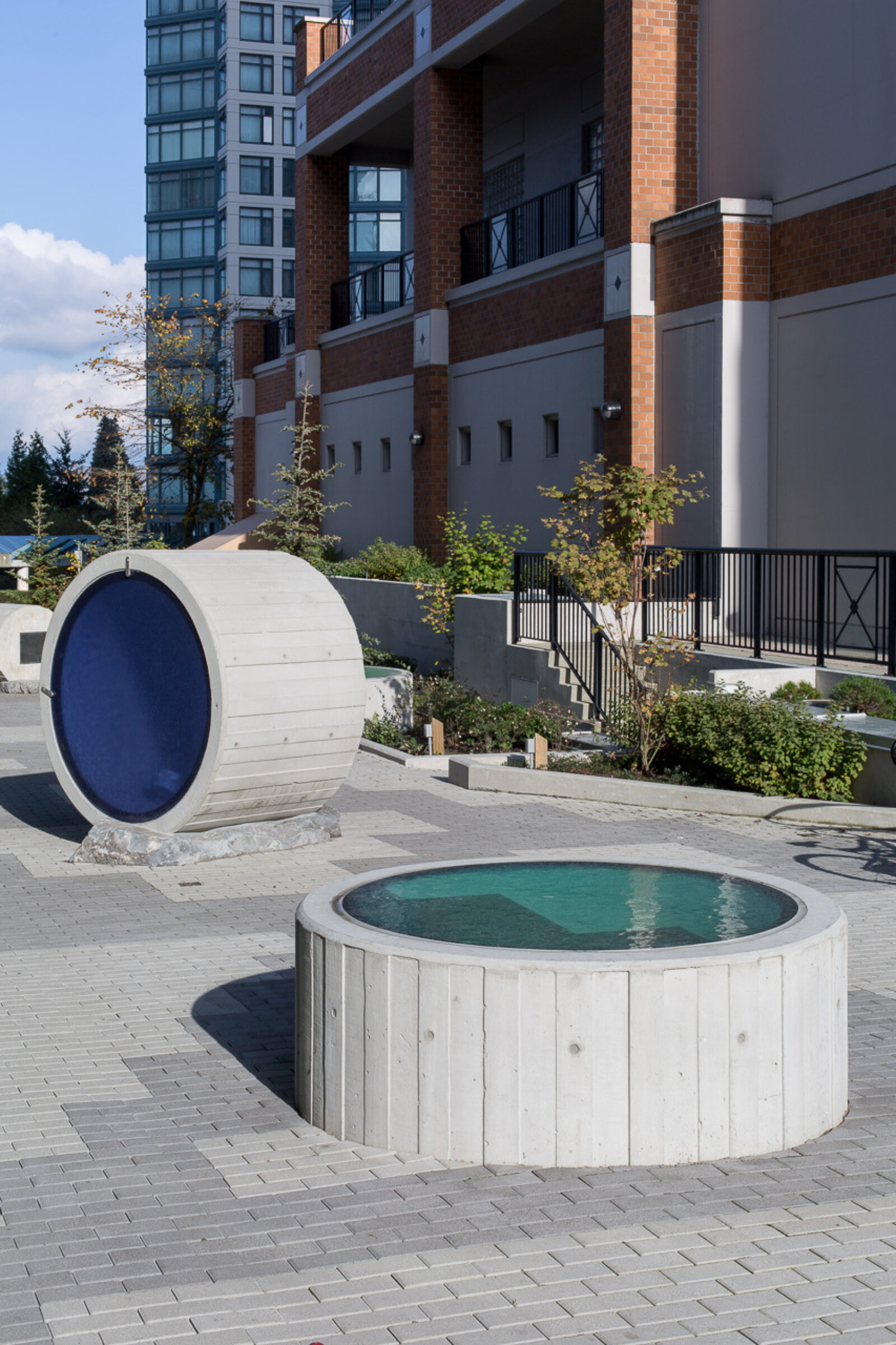 Devon Knowles, Total Running Time, 2015, concrete, glass, basalt, LED, stainless steel, native plantings, dimensions variable. Installation view, Burnaby, Canada, 2015
