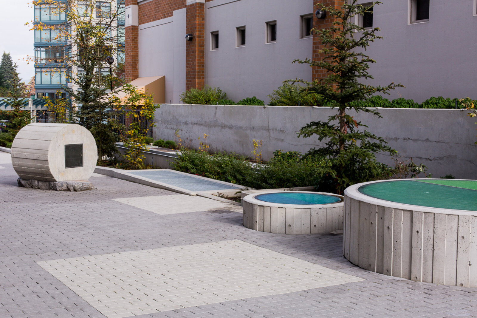 Devon Knowles, Total Running Time, 2015, concrete, glass, basalt, LED, stainless steel, native plantings, dimensions variable. Installation view, Burnaby, Canada, 2015