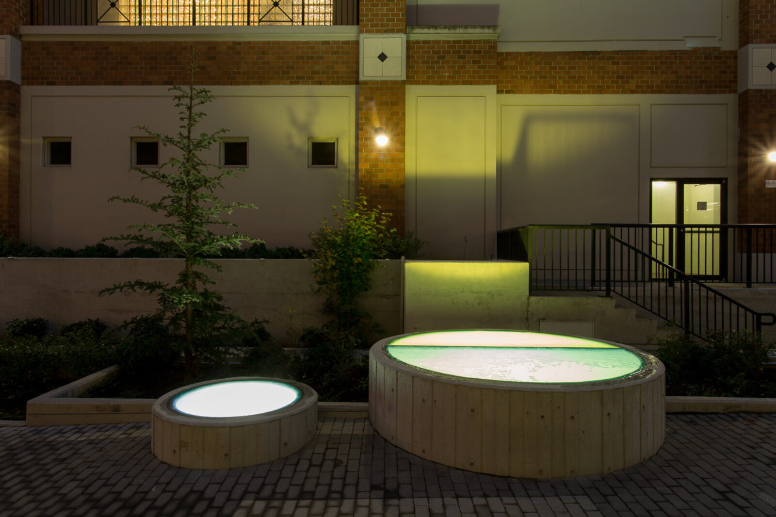 Devon Knowles, Total Running Time, 2015, concrete, glass, basalt, LED, stainless steel, native plantings, dimensions variable. Installation view, Burnaby, Canada, 2015