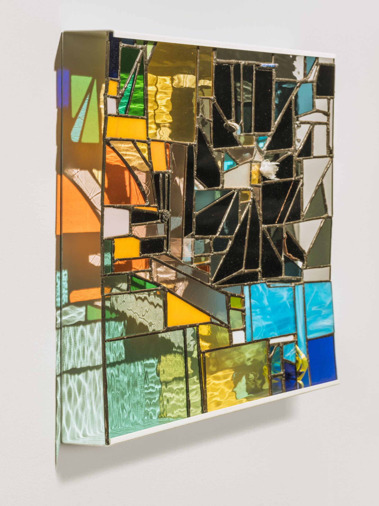 Devon Knowles, Walking Spectrum I S17, 2018, glass, plastic bag, plastic packaging, plastic ribbon, rolling paper packaging, CAD currency, lead, tin, asphalt, styrofoam, leaves, copper, steel, paint, 20 x 20 x 2 in. (51 x 51 x 5 cm)