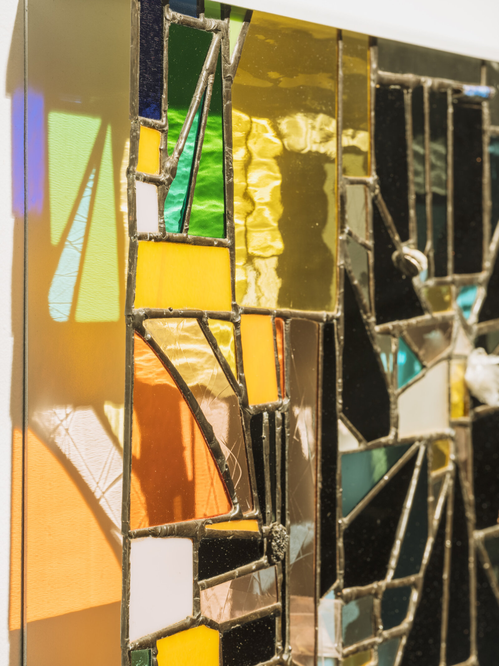 Devon Knowles, Walking Spectrum I S17 (detail), 2018, glass, plastic bag, plastic packaging, plastic ribbon, rolling paper packaging, CAD currency, lead, tin, asphalt, styrofoam, leaves, copper, steel, paint, 20 x 20 x 2 in. (51 x 51 x 5 cm)