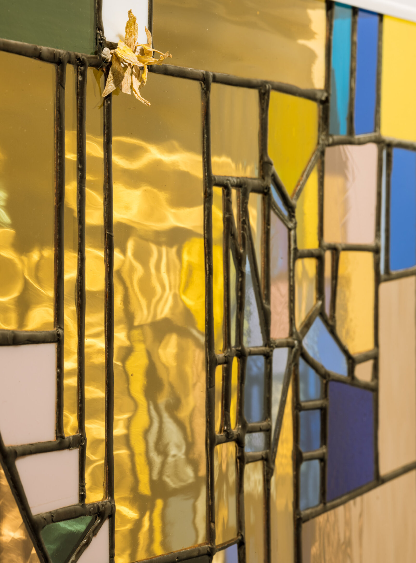 Devon Knowles, Walking Spectrum II, i, S17 (detail), 2018, glass, flower petals, iPod glass, paper cup, felt pen, reusable adhesive putty, lead, tin, steel, paint, 20 x 20 x 3 in. (51 x 51 x 8 cm)