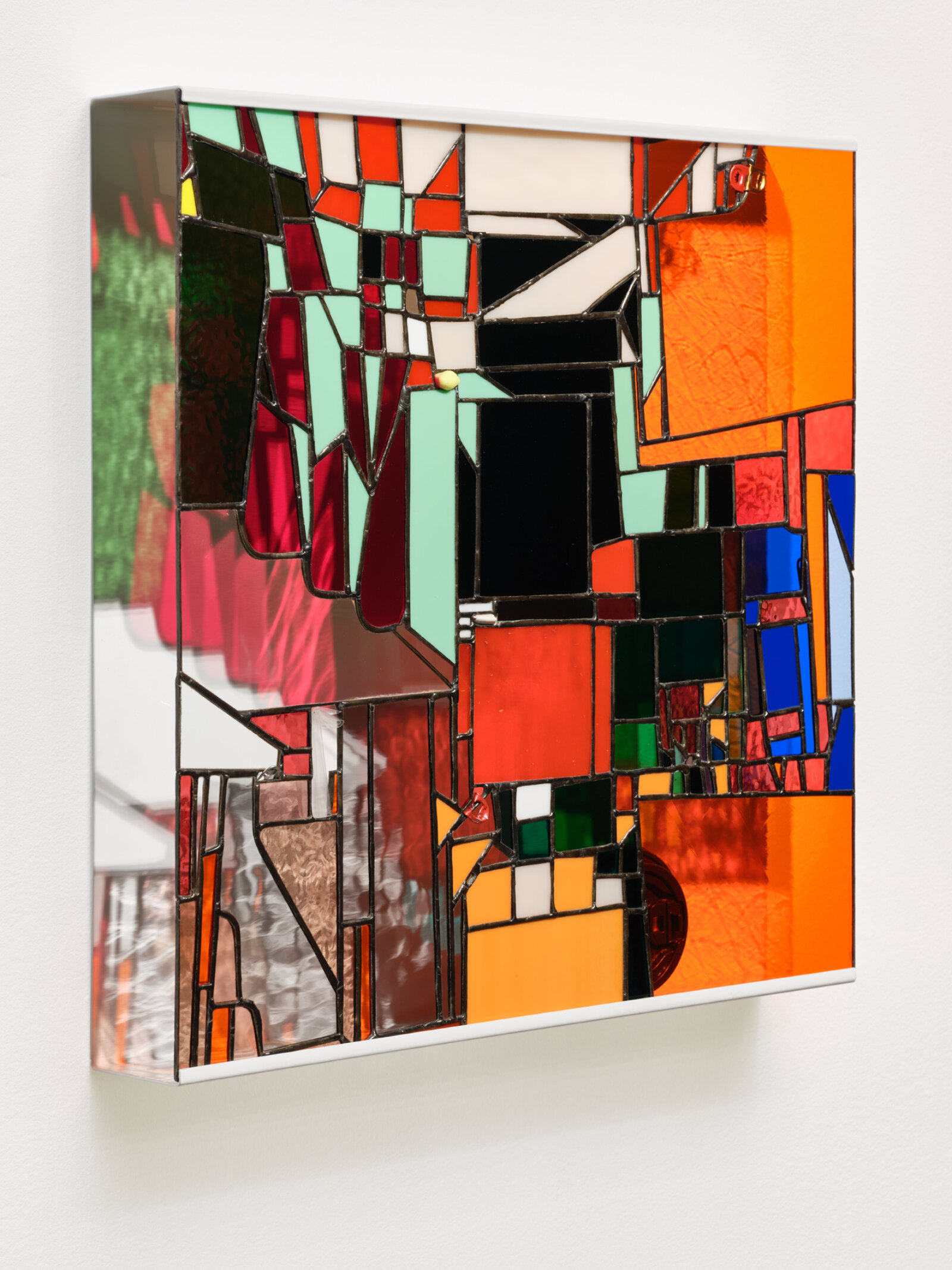 Devon Knowles, Walking Spectrum, III, i, S18, 2019, glass, aluminum tabs, cellophane envelope, plastic lid, foam earplug, steel zipper, paper receipt, lead, tin, steel, paint, 20 x 20 x 3 in. (51 x 51 x 8 cm)