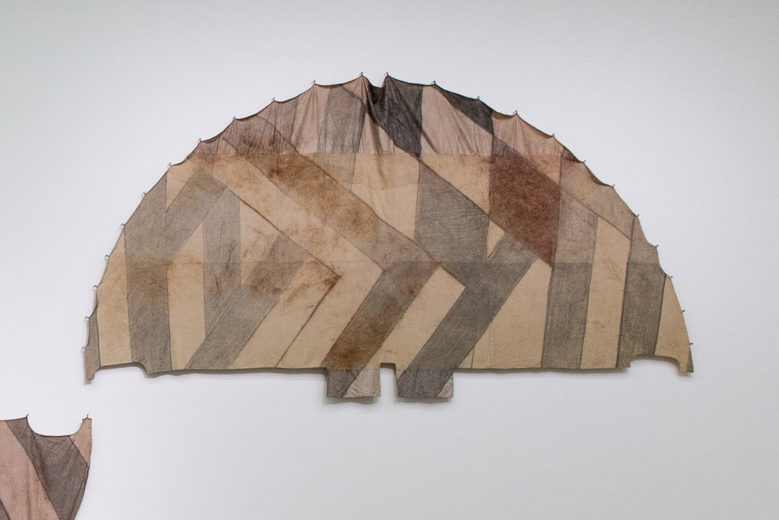 Duane Linklater, Tipi cover for unknown future horizon / Indian lemonade diamond for Mina, 2018, digital print on hand-dyed linen, cedar, sumac, charcoal, nails, 113 x 213 in. (287 x 541 cm). Installation view, Post-Nature—A Museum as an Ecosystem, Taipei Biennial 2018, Taipei Fine Arts Museum, Taiwan, 2018