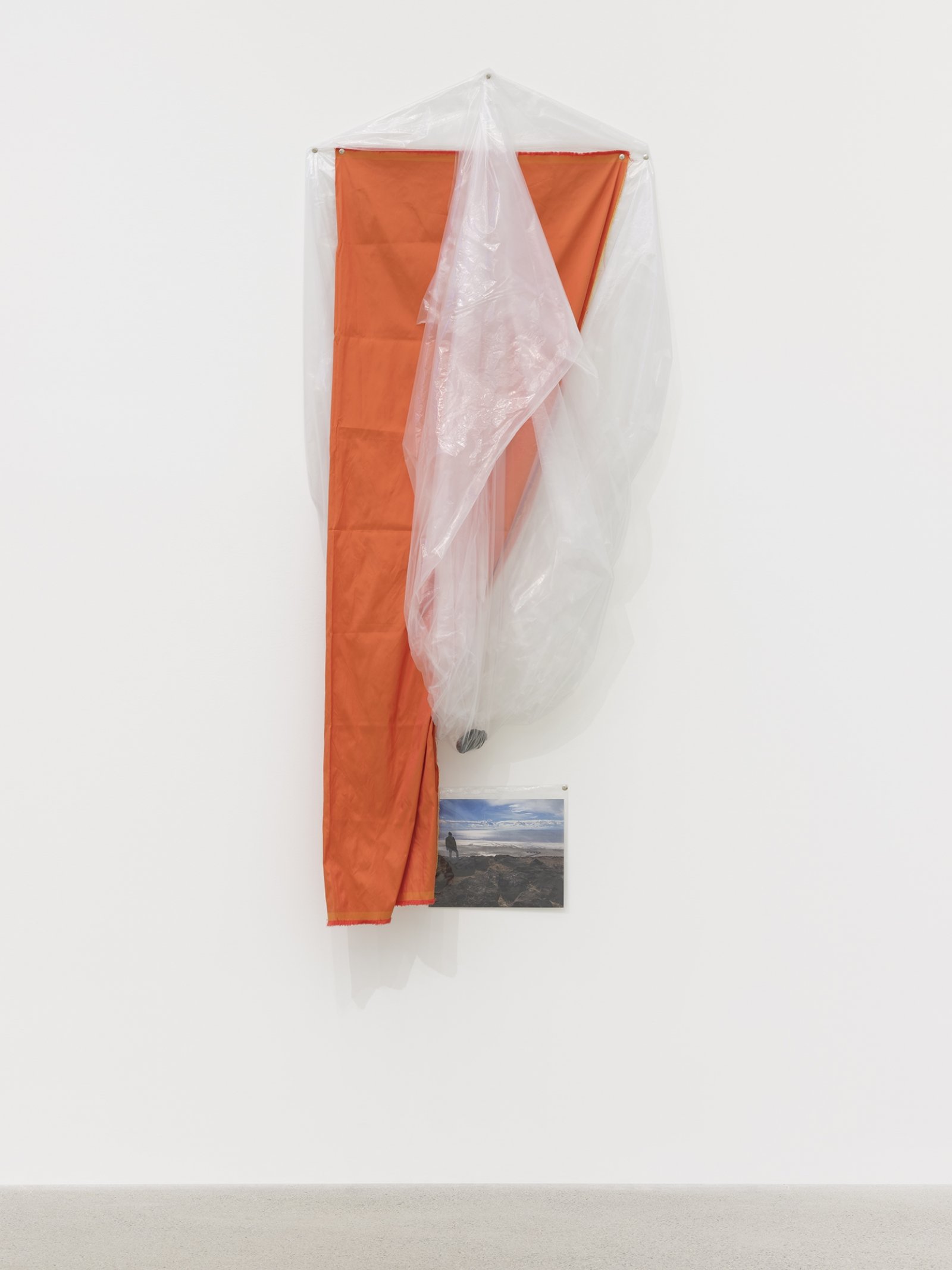 Duane Linklater, coup, 2016, plastic sheeting, polyester cloth, stone from Spiral Jetty, thumbtacks, colour photograph, 67 x 43 x 8 in. (170 x 109 x 20 cm)