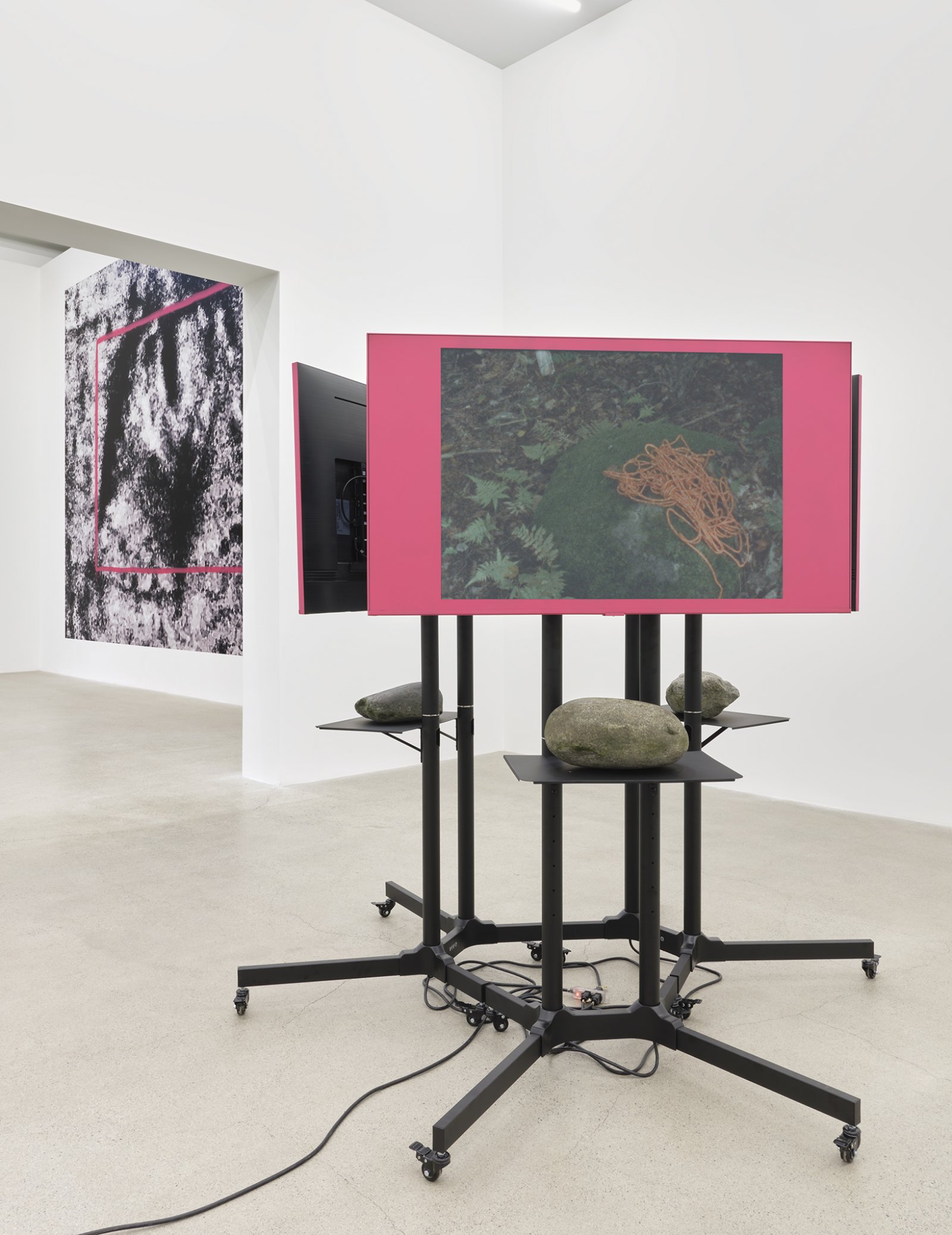 Duane Linklater, primaryuse, 2020, lcd screens, television stands, media players, spray paint, stones, 3 super 8mm film transfers to 2k video with audio, score by eagles with eyes closed, looping: 5 minutes, 19 seconds; 5 minutes, 10 seconds; 5 minutes, 23 seconds; 69 x 72 x 72 in. (175 x 183 x 183 cm)