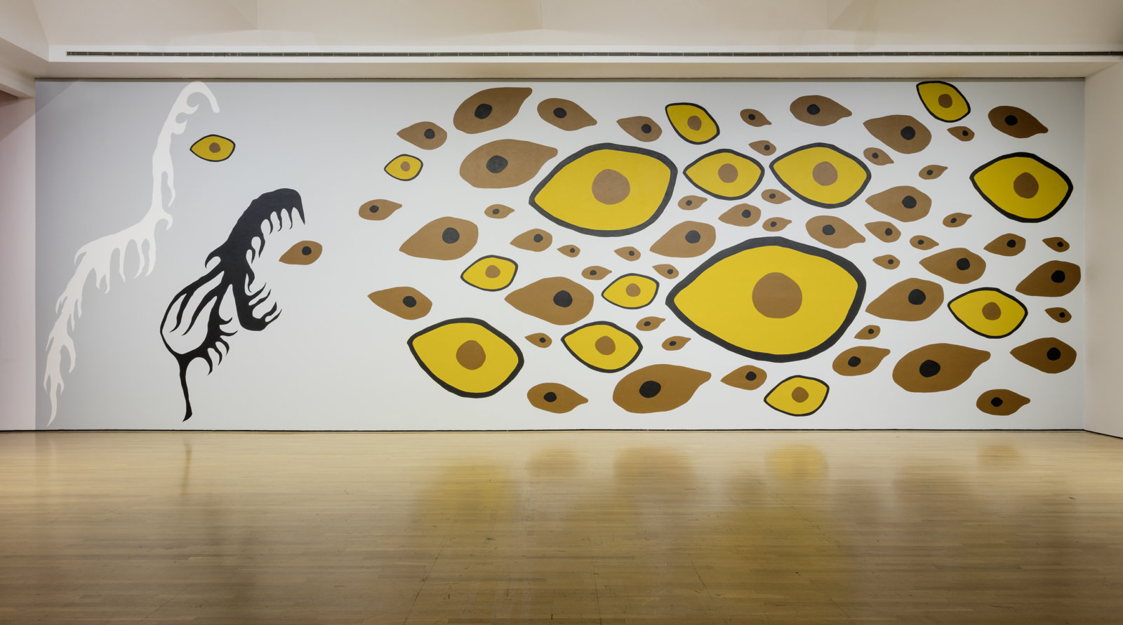 Duane Linklater, Earth Mother Hair, Indian Hair, and Earth Mother Eyes, Indian Eyes, Animal Eyes, 2017, paint on interior wall of the Musée d’art contemporain de Montréal, from a series of small paintings of eyes and hair based on a photo of Norval Morrisseau’s Earth Mother and Her Children (1967), painting labour by Julie Ouellet, absence of the artist, dimensions variable. Installation view, In Search of Expo 67, Musée d’art contemporain de Montréal, 2017