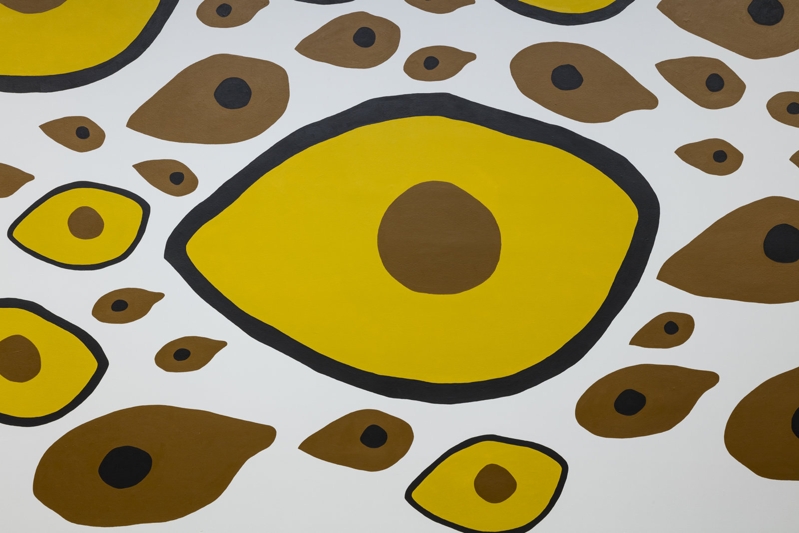 Duane Linklater, Earth Mother Hair, Indian Hair, and Earth Mother Eyes, Indian Eyes, Animal Eyes (detail), 2017, paint on interior wall of the Musée d’art contemporain de Montréal, from a series of small paintings of eyes and hair based on a photo of Norval Morrisseau’s Earth Mother and Her Children (1967), painting labour by Julie Ouellet, absence of the artist, dimensions variable. Installation view, In Search of Expo 67, Musée d’art contemporain de Montréal, 2017