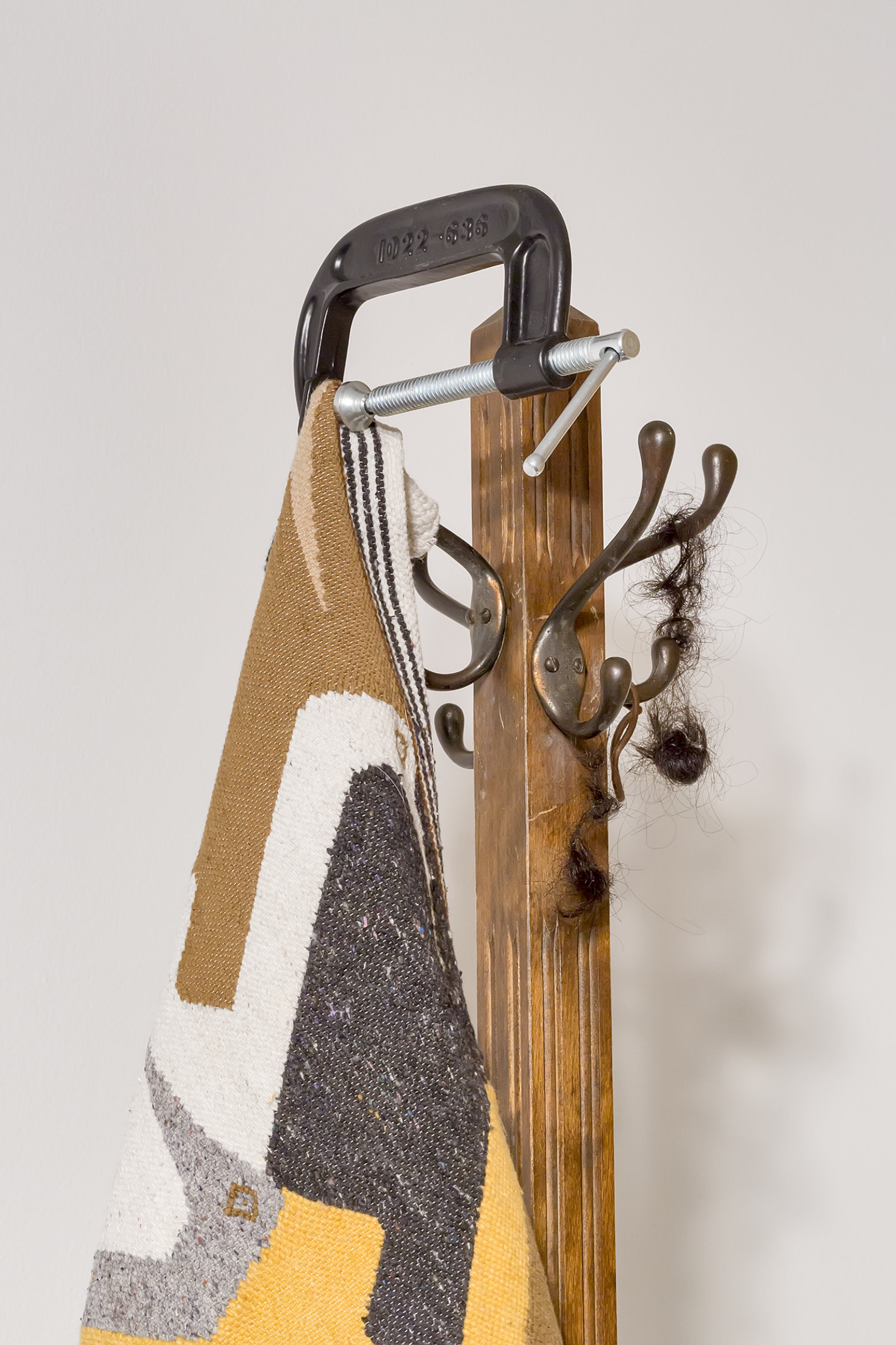 Duane Linklater, Flock (detail), 2016, wool tapestry, coathanger, steel vice, tarpaulin, gypsum, wood, steel, hair, clay, dimensions variable