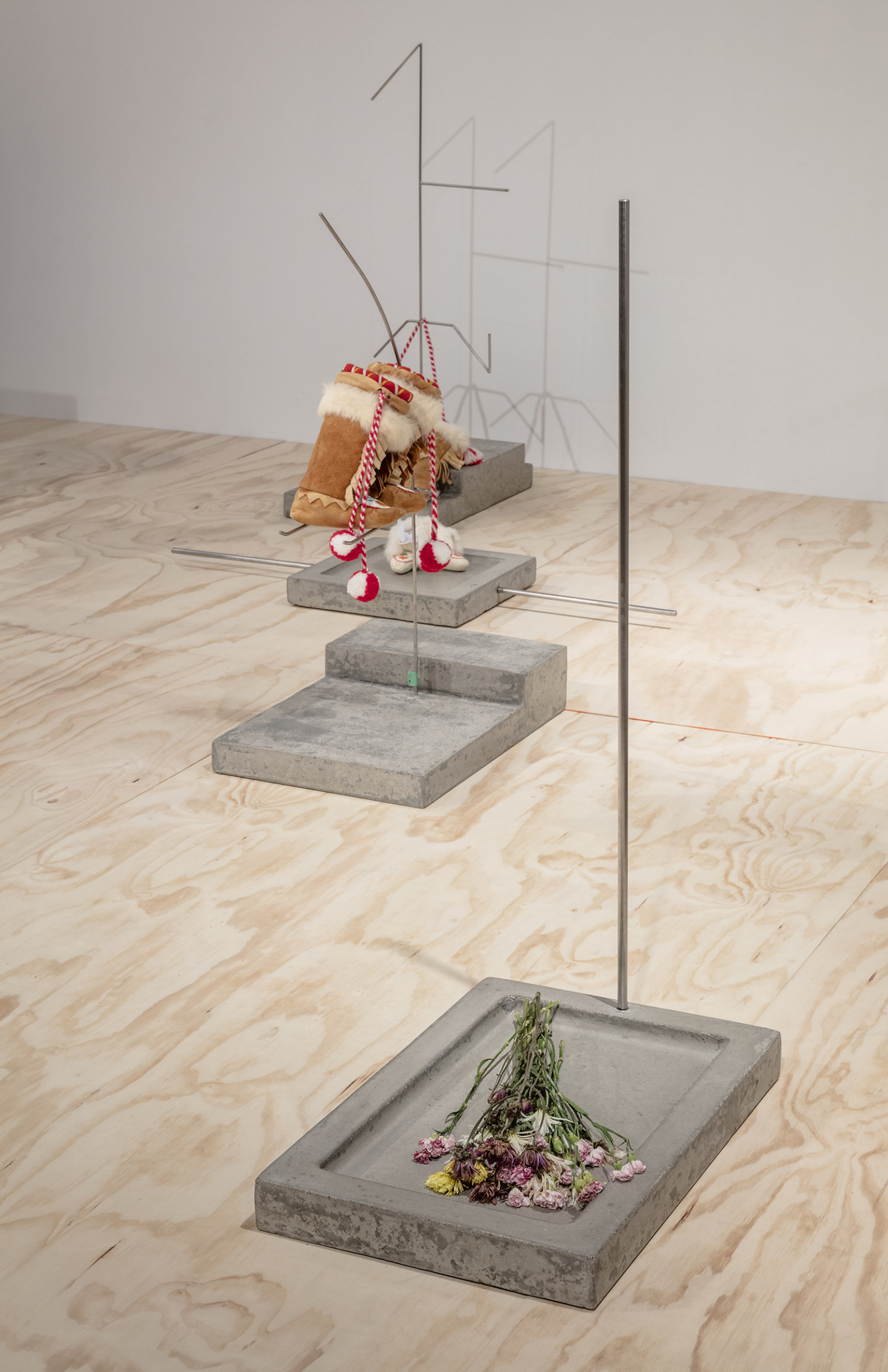 Duane Linklater, Speculative apparatus 7 for the work of nohkompan, 2016, concrete, stainless steel, flowers, 24 x 16 x 43 in. (61 x 41 x 109 cm)