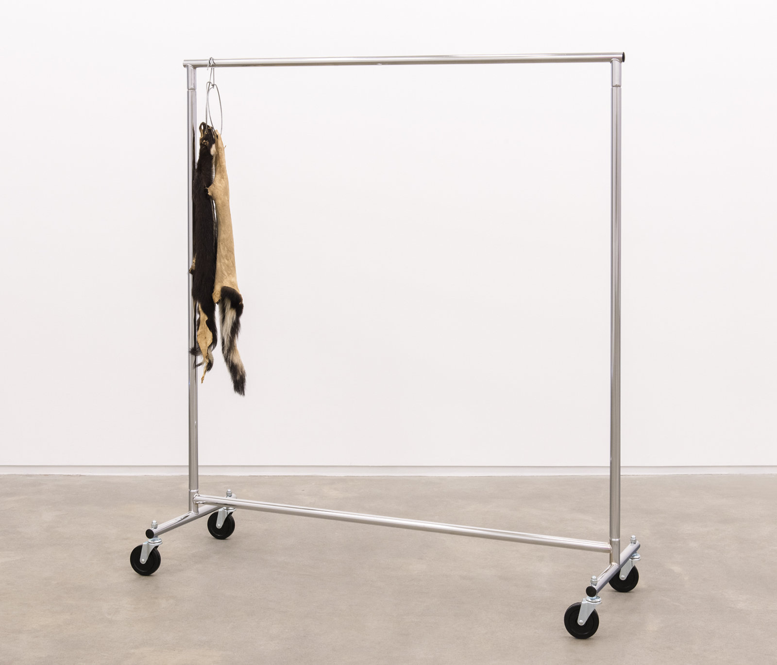 Duane Linklater, The marks left behind, 2014, skunk furs, garment rack, hangers, 66 x 60 x 20 in. (168 x 151 x 52 cm)