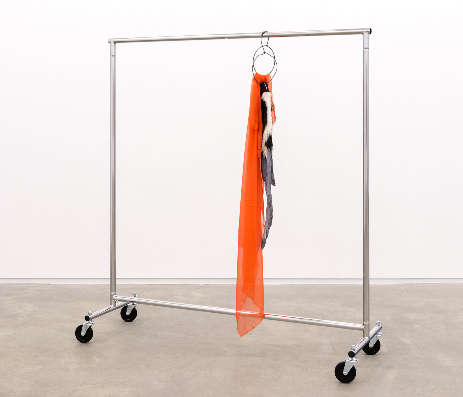 Duane Linklater, The most beautiful thing in the world, 2014, skunk fur, paint, garment rack, hangers, fabric, 66 x 60 x 20 in. (168 x 151 x 52 cm)