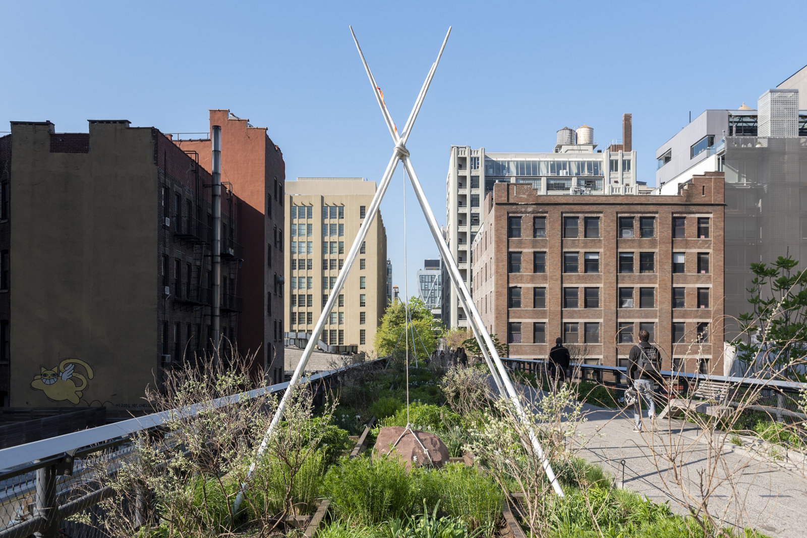 Duane Linklater, pêyakotênaw, 2018, tipi poles, rope, stones, flagging tape, paint, each approximately 181 x 143 x 143 in. (456 x 363 x 363 cm). Installation view, Agora, High Line Art, New York, 2018