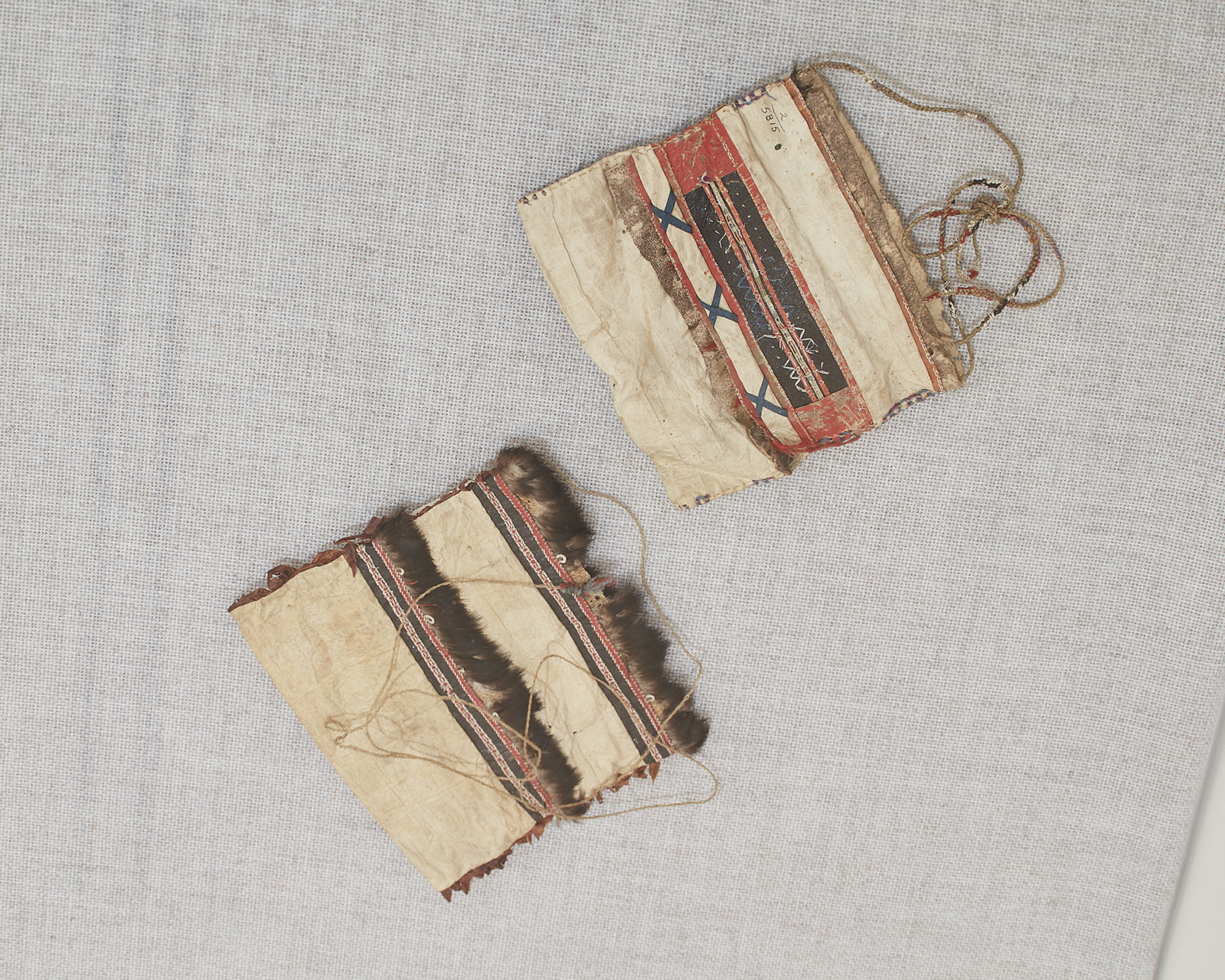 Tanya Lukin Linklater, Flat vessels made by the hands of our grandmothers that we discern and decipher as potential messages of repair (detail), 2019, Alutiiq sewing bags accessioned by the Phoebe A. Hearst Museum of Anthropology, University of California, Berkeley, in 1904; fur, graphite, gut, wool, cotton, feather, sinew, quill, skin, glass; dimensions variable. Installation view, SOFT POWER, SF MOMA, San Francisco, USA, 2019