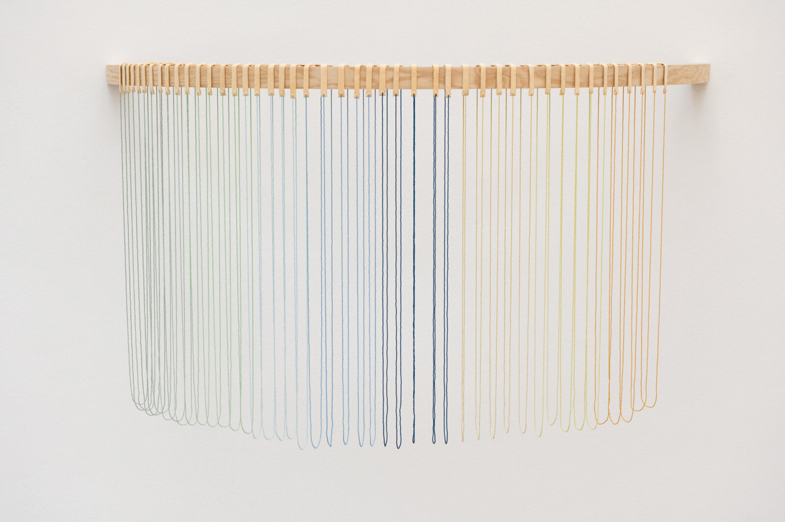 Tanya Lukin Linklater, Headwaters, 2026, 45 circular beaded strands, bentwood ash, seed beads, thread (fishing line), deer hide, 35 x 68 x 29 in. (89 x 173 x 72 cm)