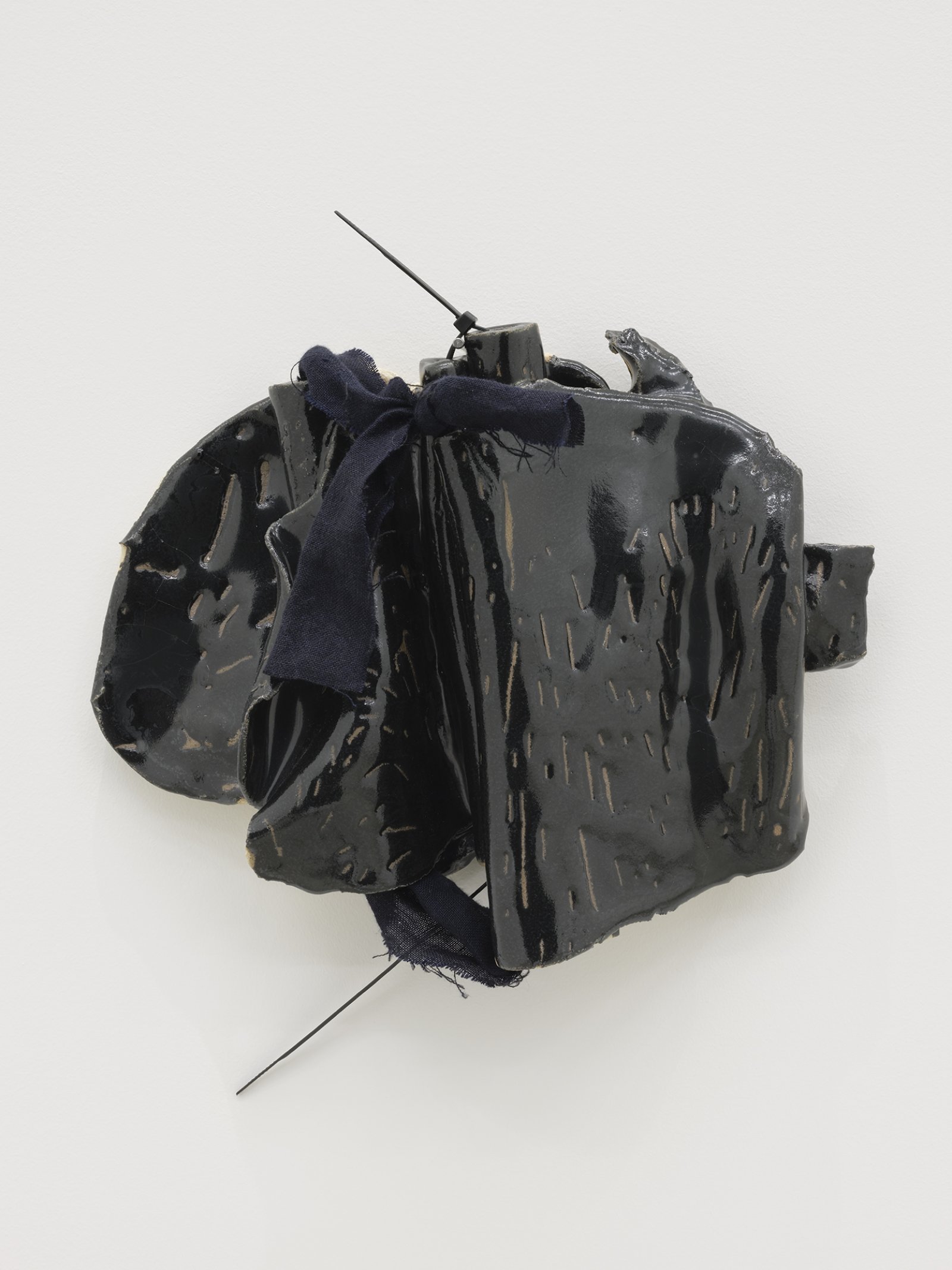 ​Christina Mackie, Token no. 10, 2019, stoneware, linen, cable ties, nail, 14 x 13 in. (36 x 32 cm) by Christina Mackie