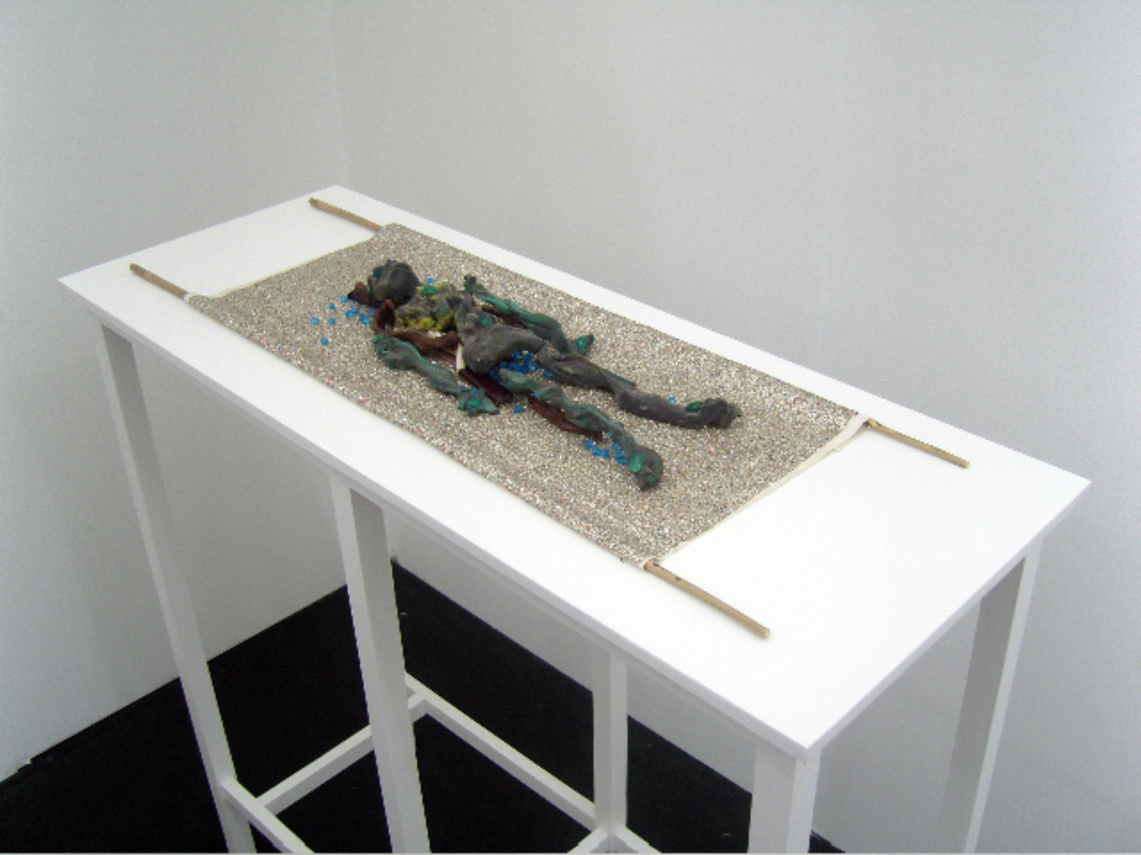 Christina Mackie, Green Figure, 2006, play-doh, green onyx, lighters, wax, rope, paint in seashell, glass beads, fabric and bamboo, 36 x 12 in. (92 x 30 cm)